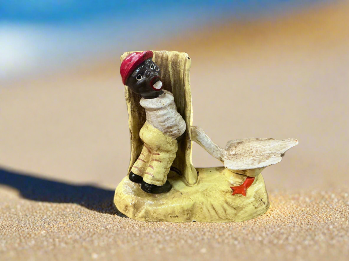 Cast iron boy peeing on tree