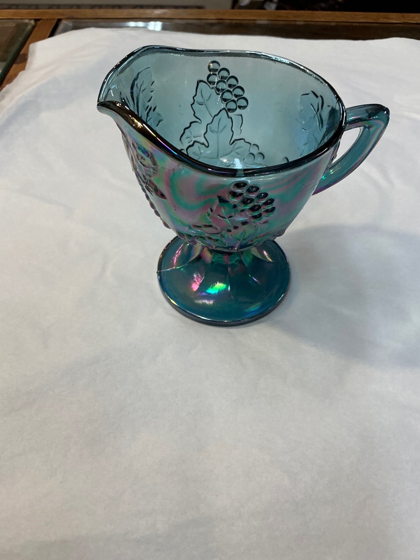 Glassware Iridescent, mostly blue with rainbow reflections Glass