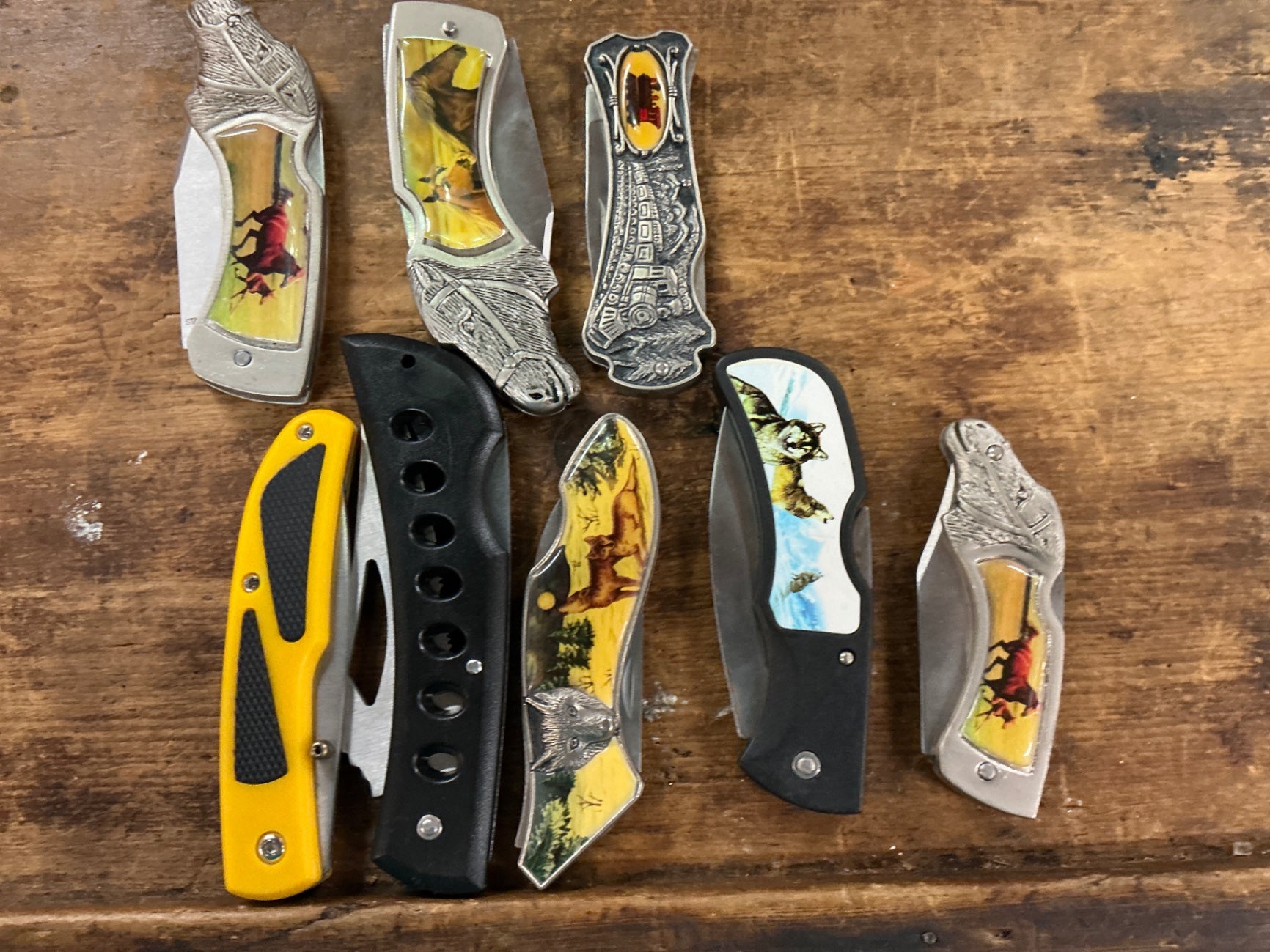 Various (not specified) Multicolored (Scenes and Characters) Metal (likely stainless steel or similar) with decorative inlays Knife Collection
