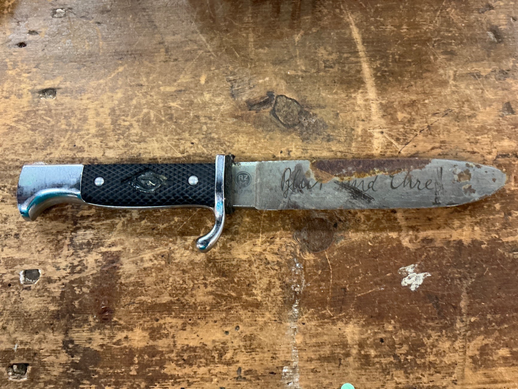 Silver/Gray and Black Metal (likely stainless steel) and possibly plastic handle Kitchen & Dining
