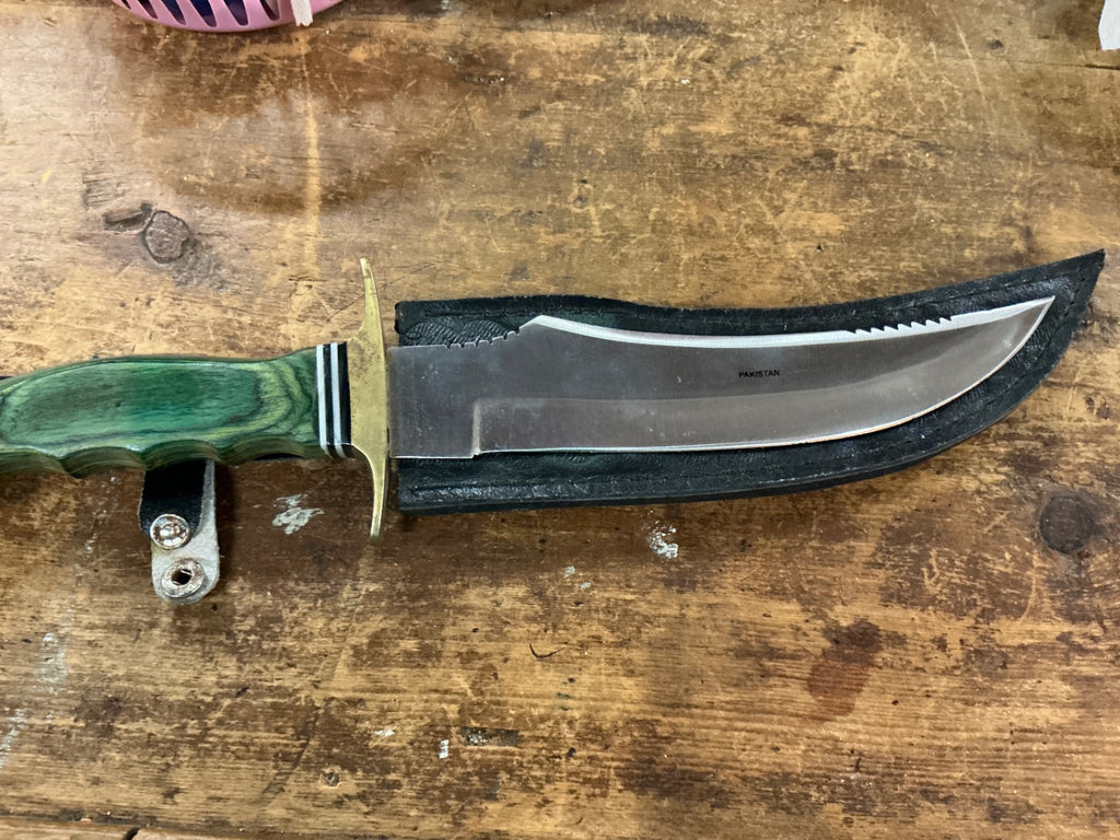 PAKISTAN Silver and green Metal and possibly plastic or bakelite (handle) Knife