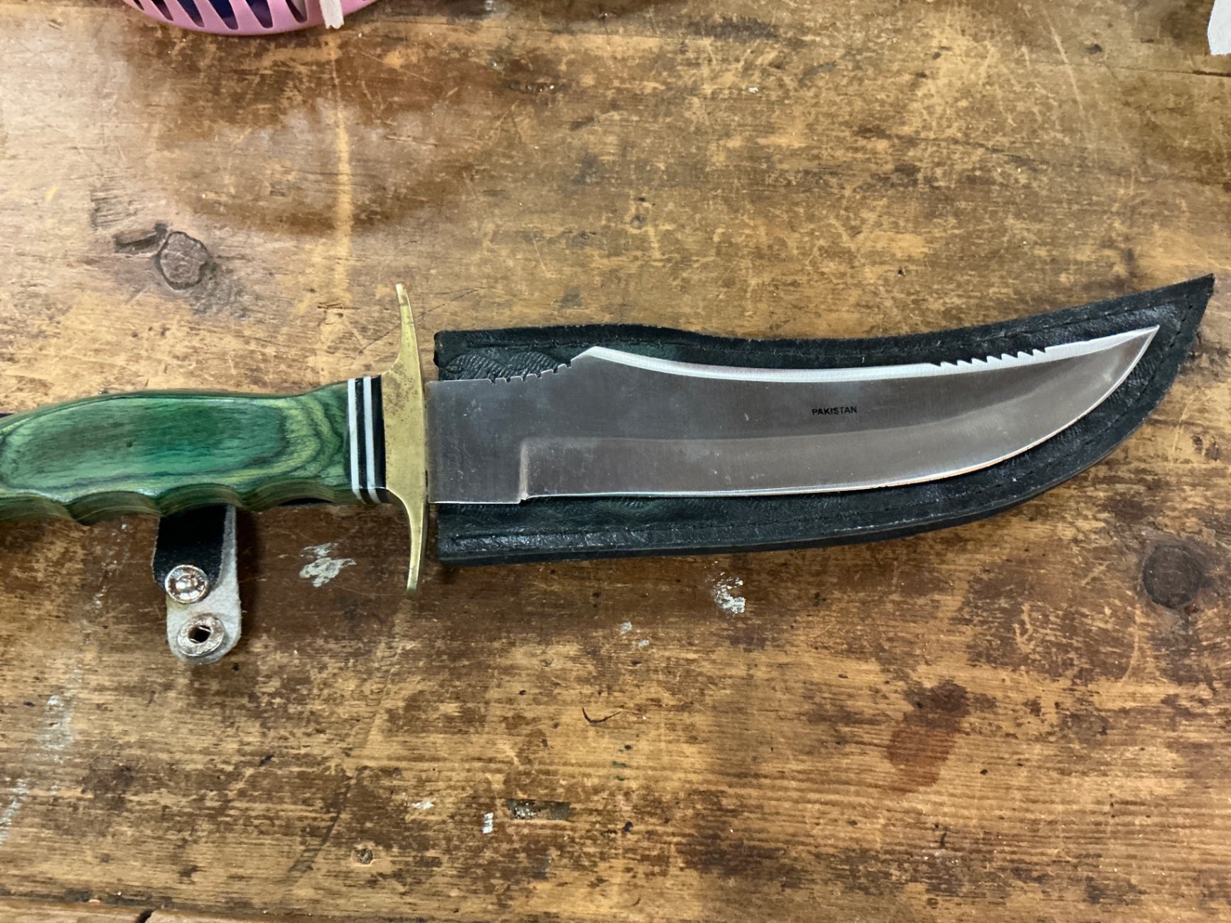 PAKISTAN Silver and green Metal and possibly plastic or bakelite (handle) Knife