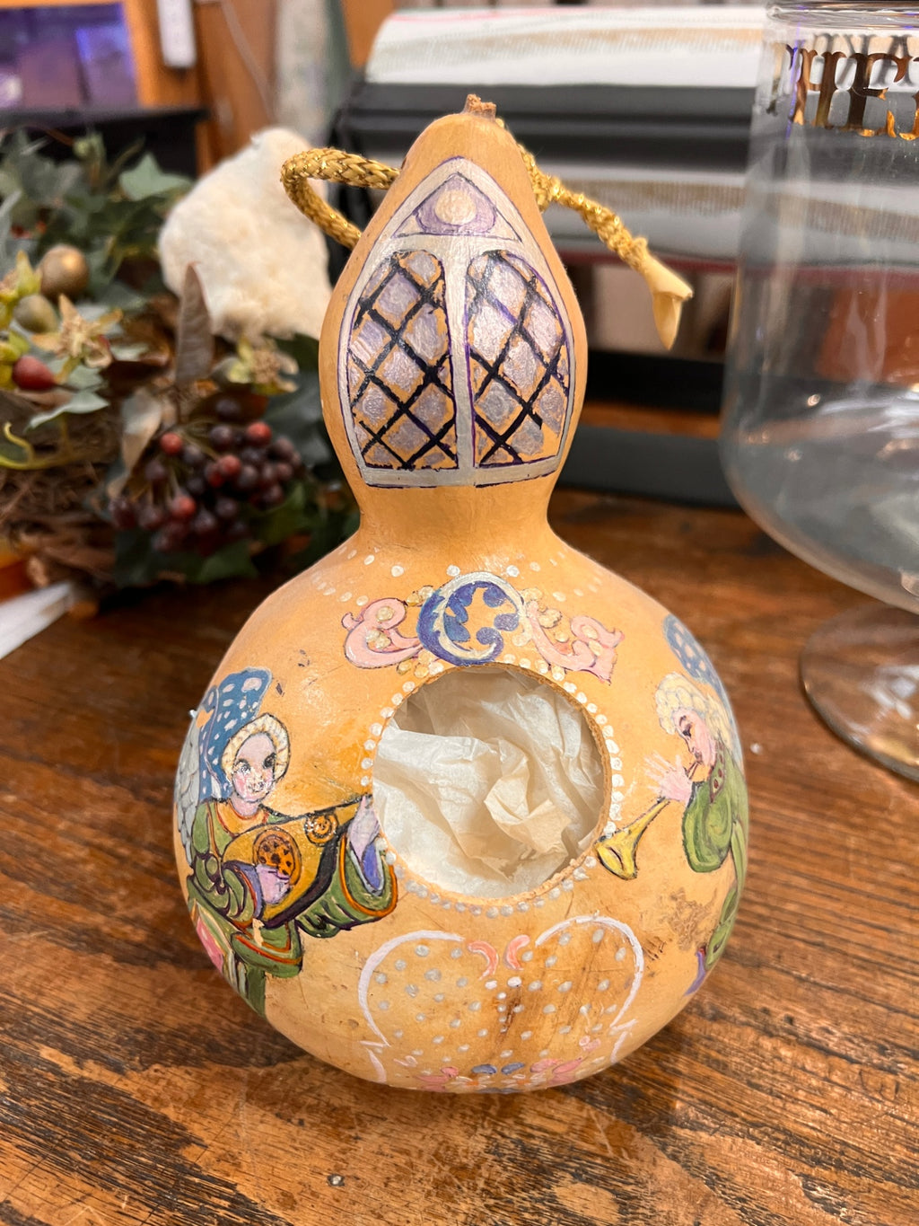 Hand-painted dried gourd ornament/lantern, signed Claire de Hoffman, dated 1997. Features angelic musicians and decorative motifs.