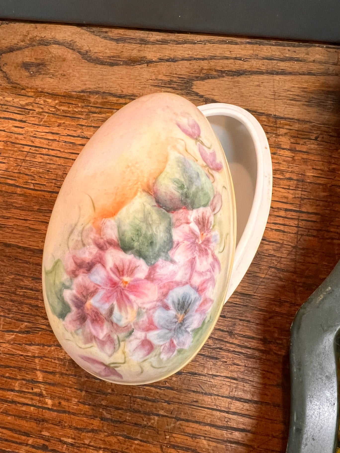 porcelain trinket box in the shape of an egg