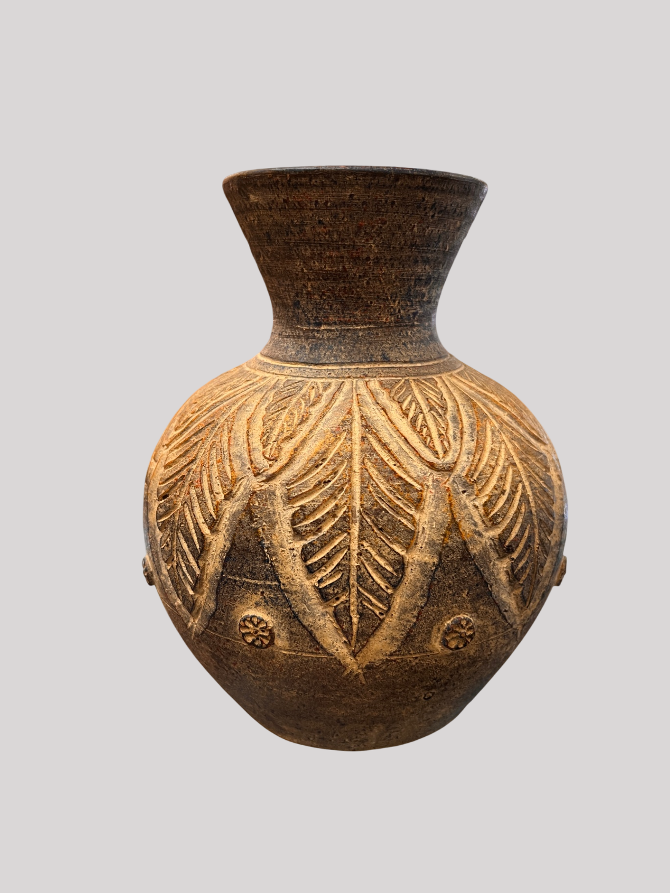 Hand-carved earthenware/stoneware vase with incised leaf and rosette decoration. Likely folk/studio pottery, mid-to-late 20th century
