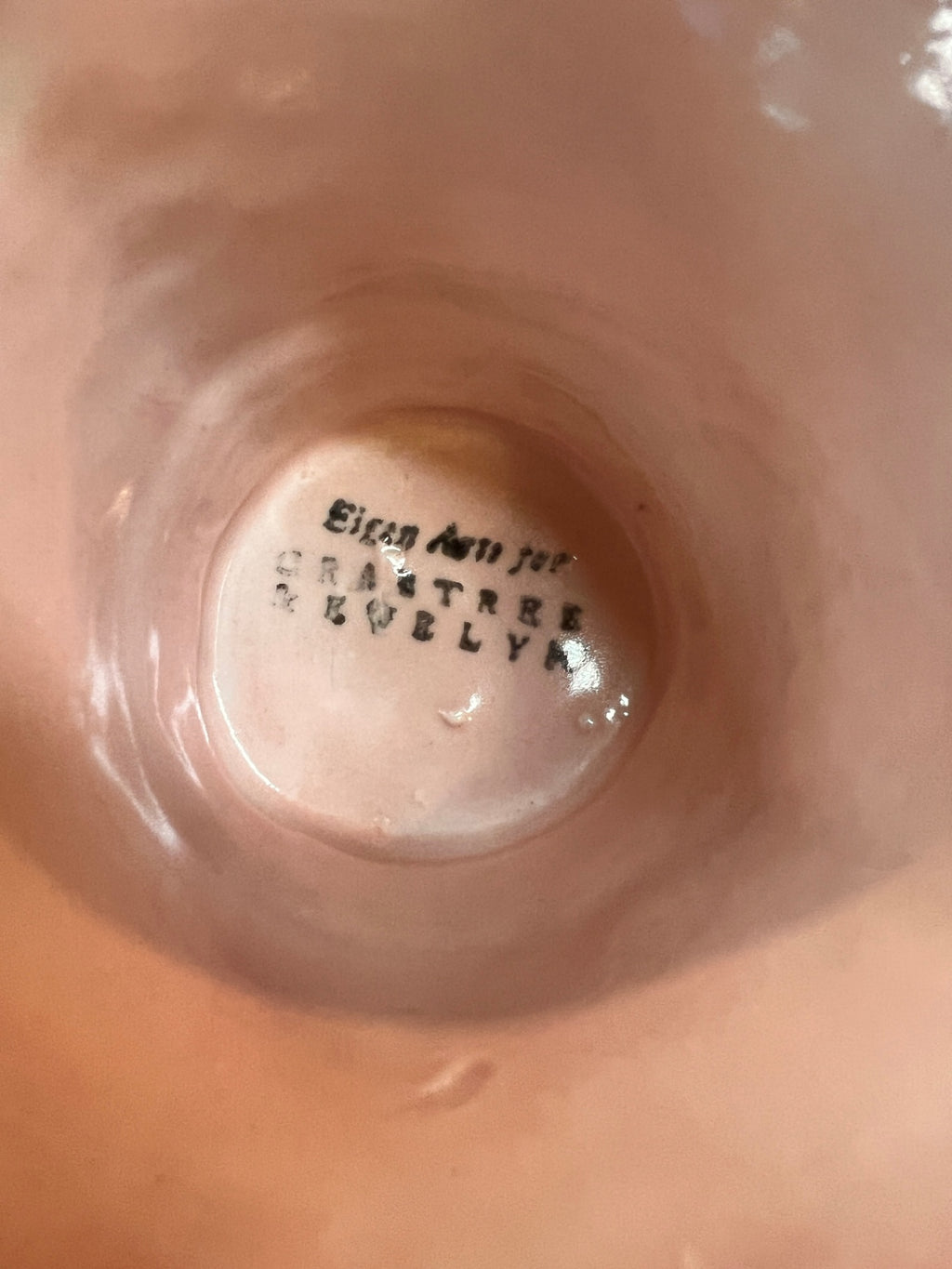 pink pedestal dish/compote, and the stamp inside reads:  "Eison Art Pottery – Crabtree, Evelyn."