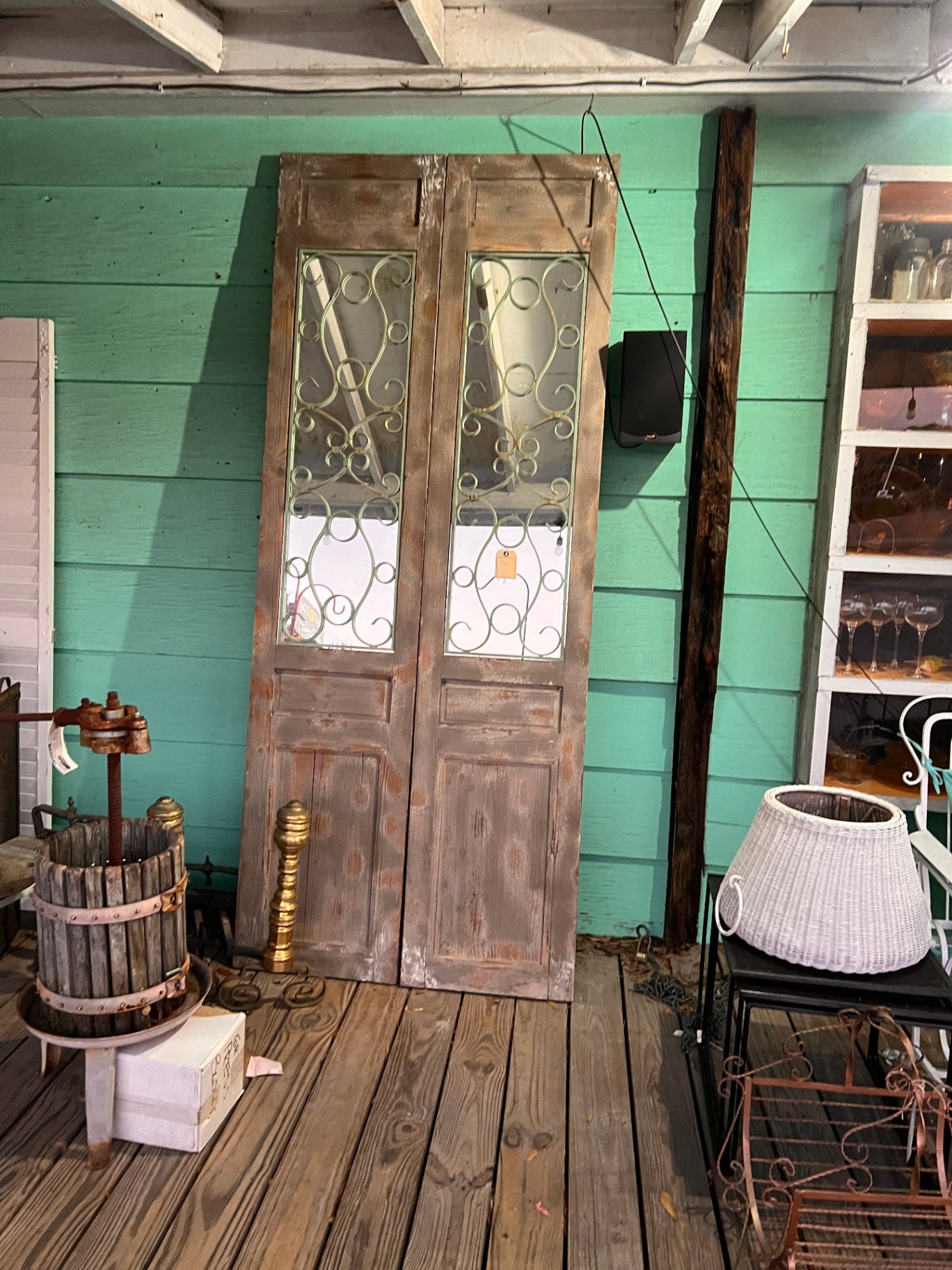 Pair of Weathered Decorative Wood Doors with Iron Scroll Inserts