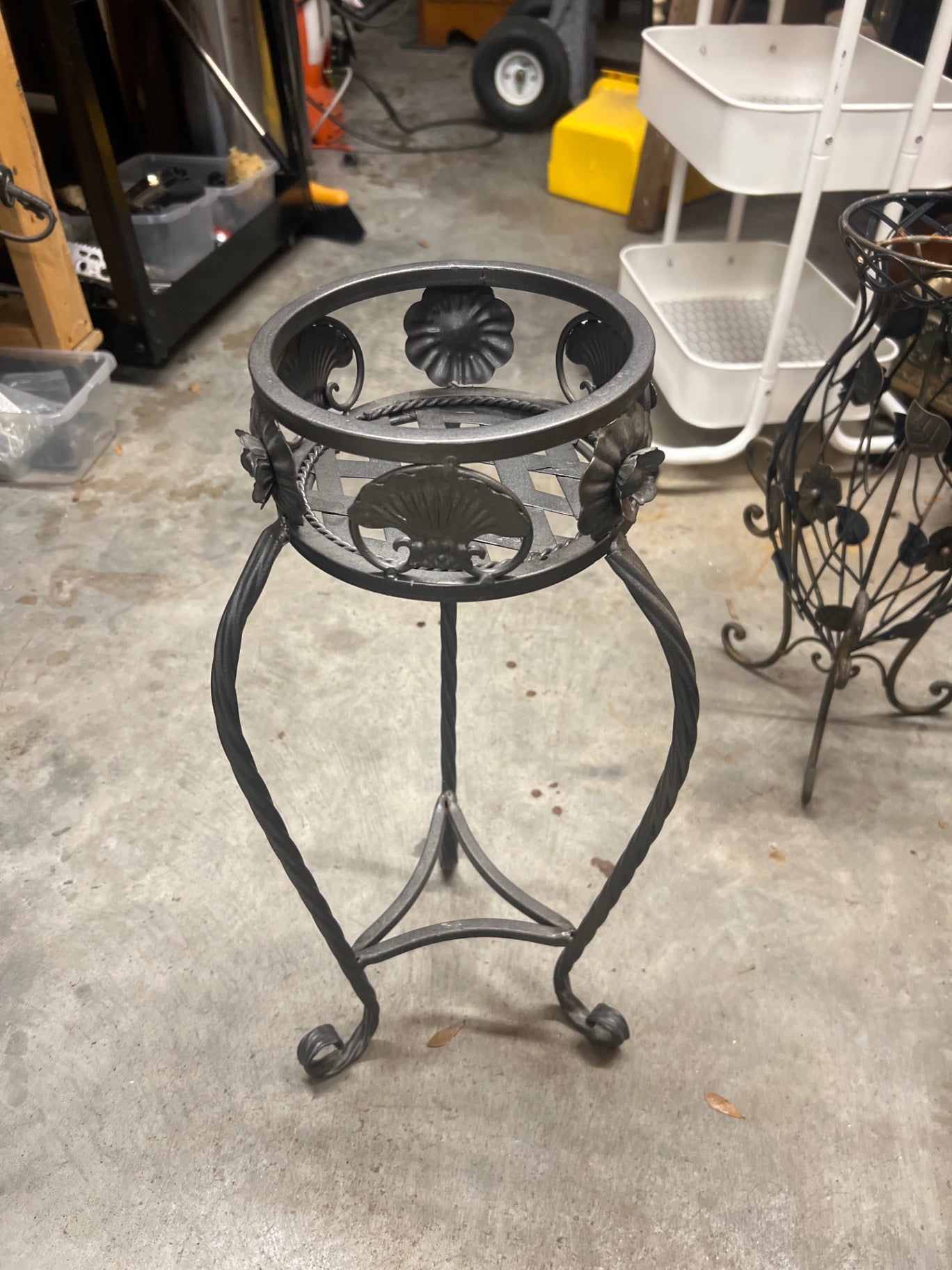 Iron plant stand approximately 20 inches tall