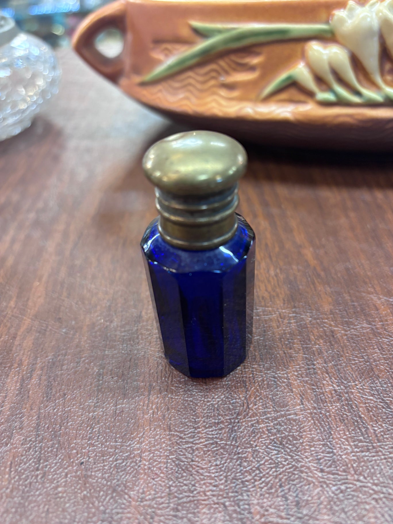 Vintage cobalt blue glass perfume or scent bottle with a brass cap. 