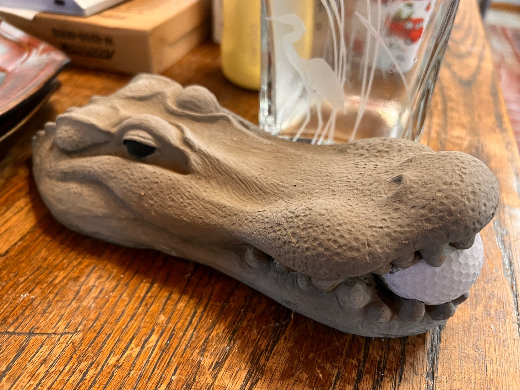 Concrete Alligator Head Holding Golf Ball