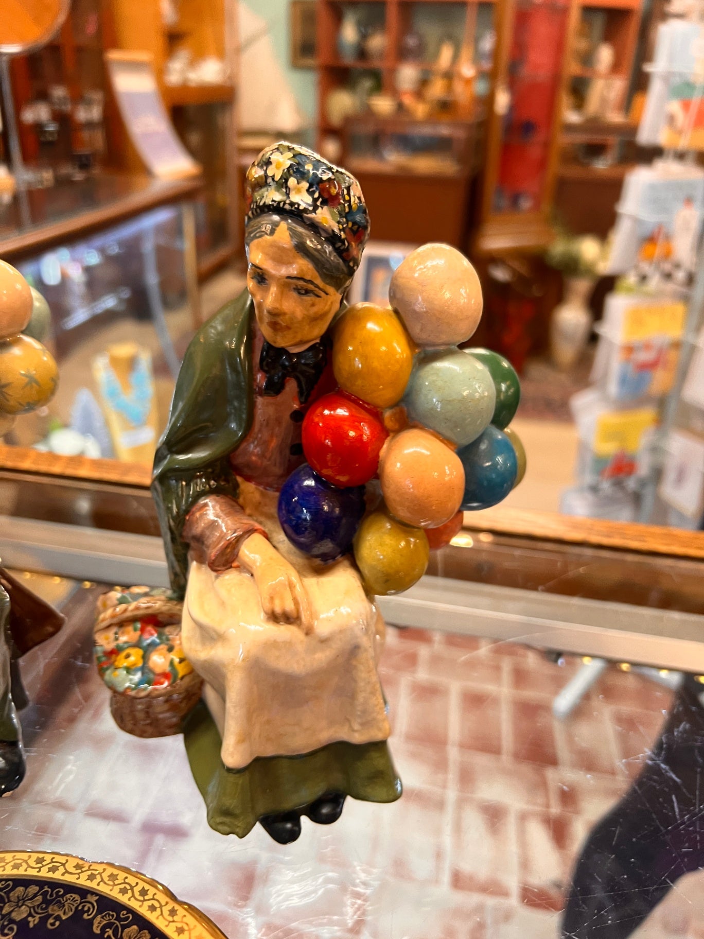 Vintage Porcelain Balloon Seller Figurine – Seated Woman with Basket