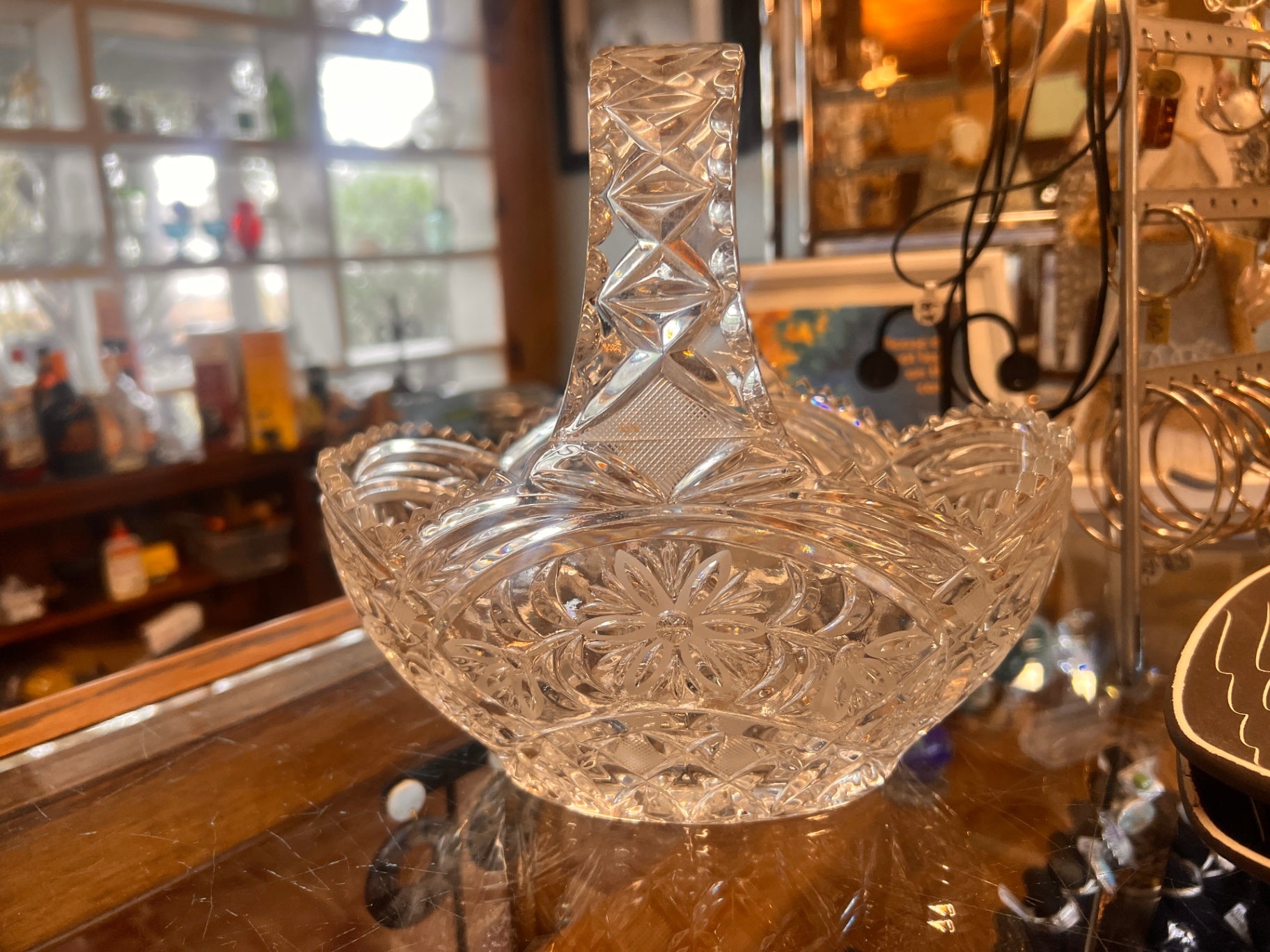 Heavy crystal basket featuring a starburst/pinwheel design. 