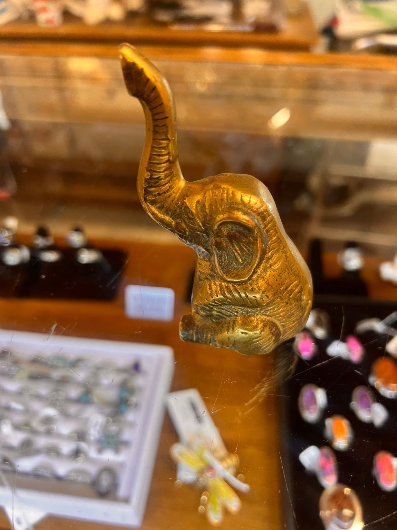 Solid brass elephant figurine with its trunk raised for good luck