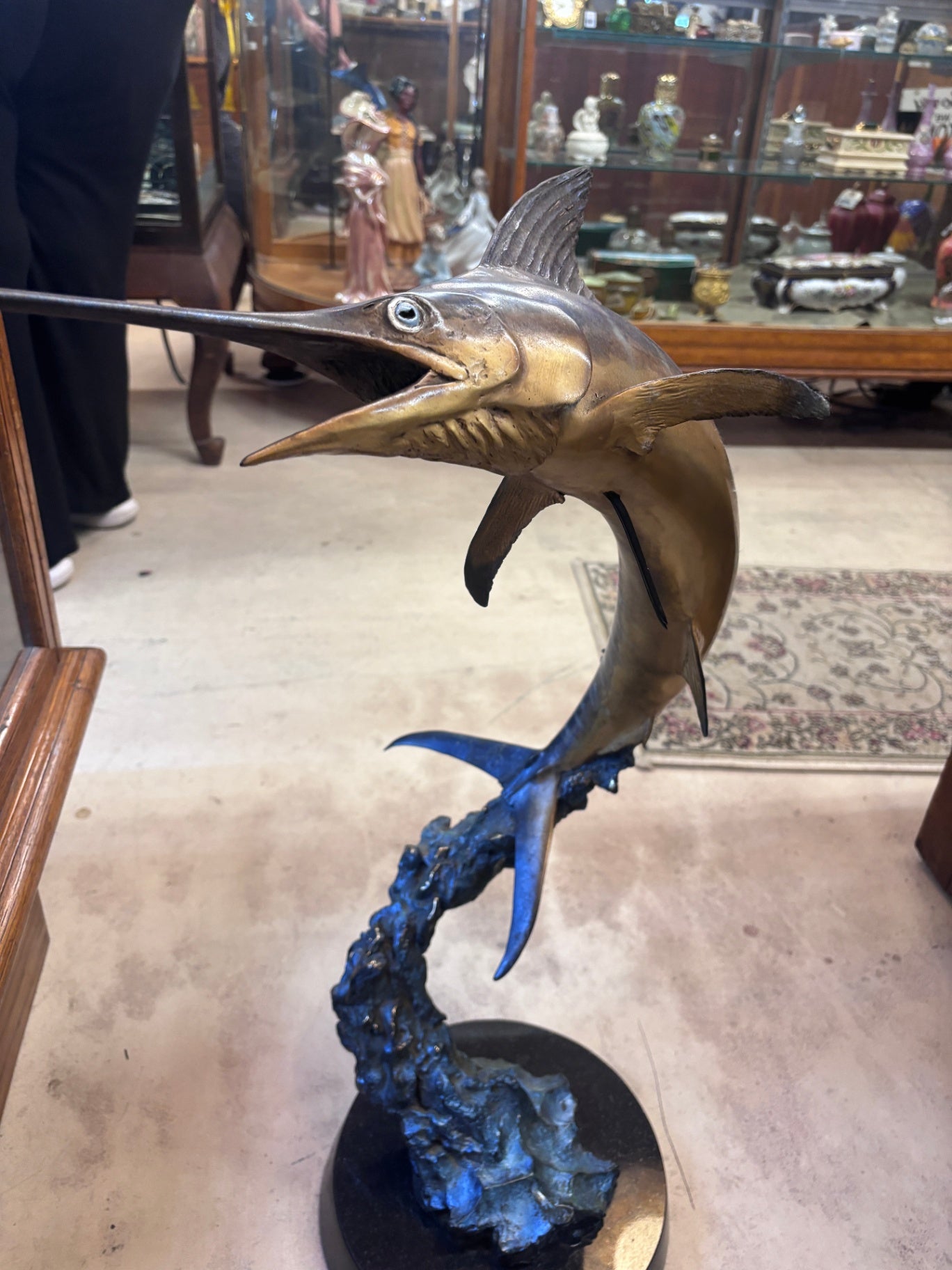 Bronze sculpture depicting a leaping marlin