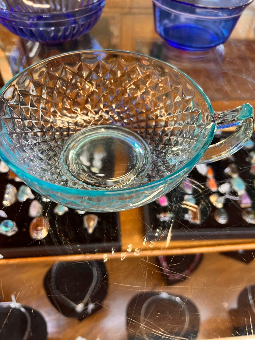 Transparent teal or light blue glass bowl with Handle
