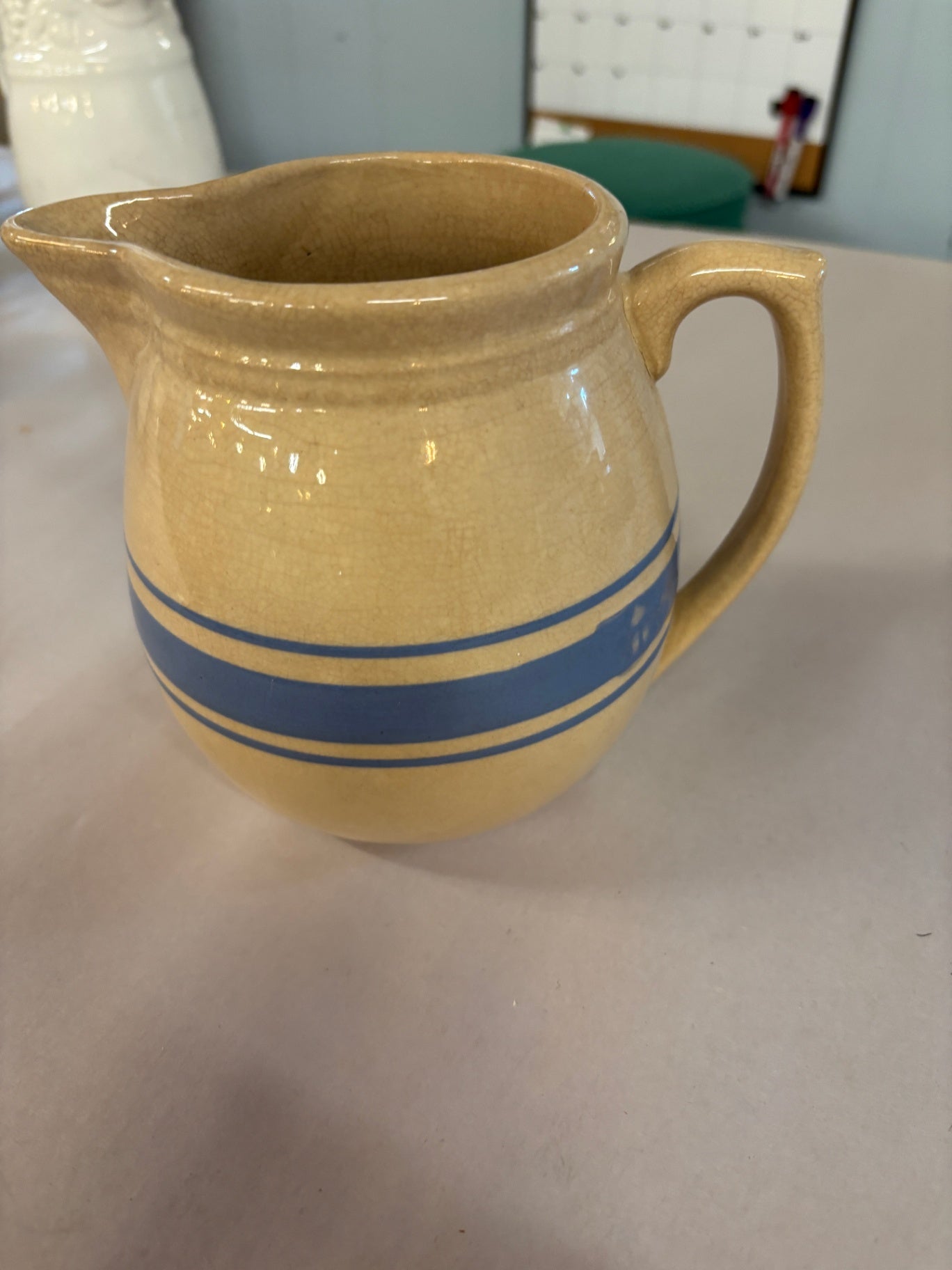 vintage Weller blue banded pitcher. Stained and crazed.