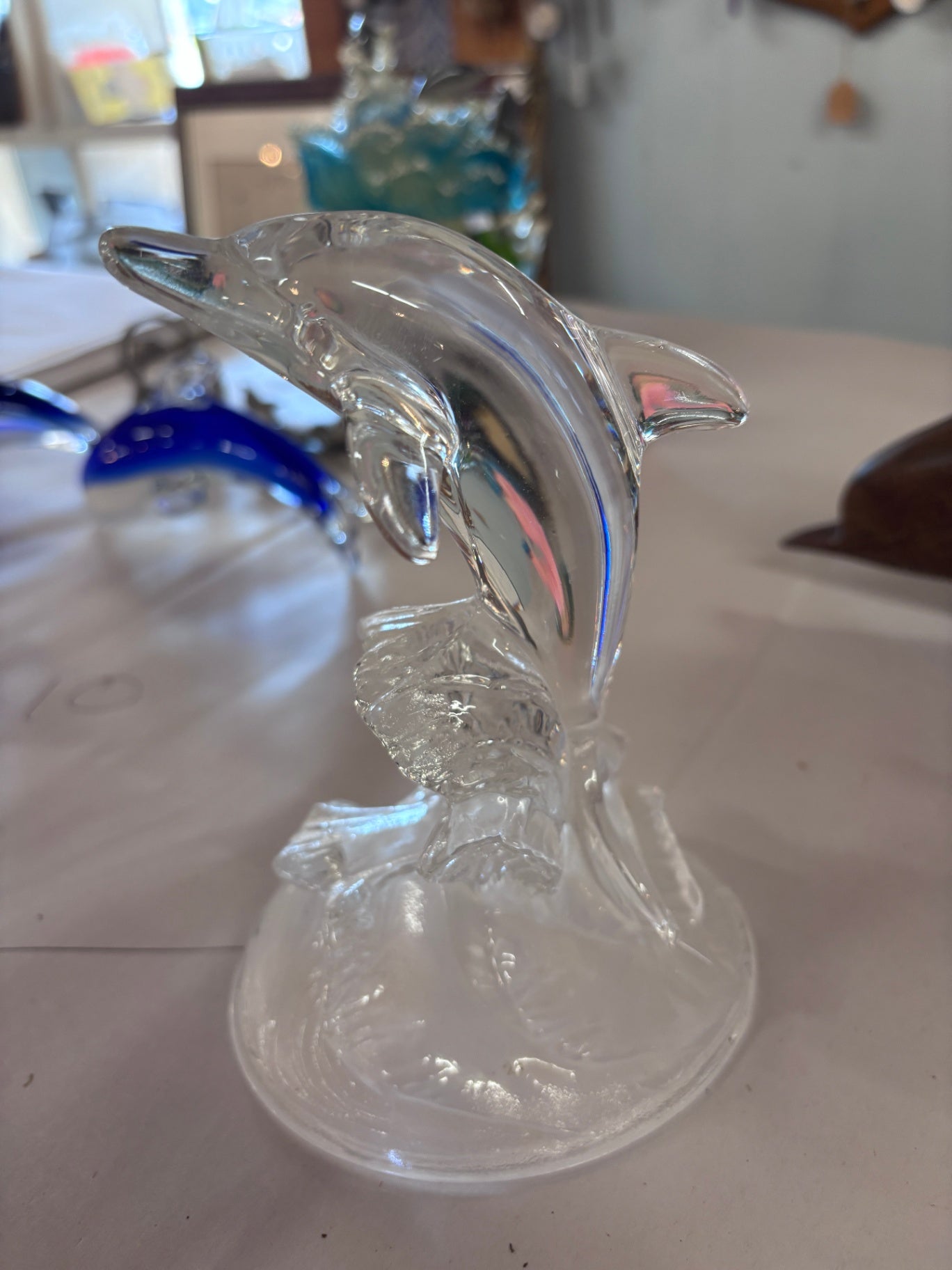 Glass Dolphin Jumping in Waves