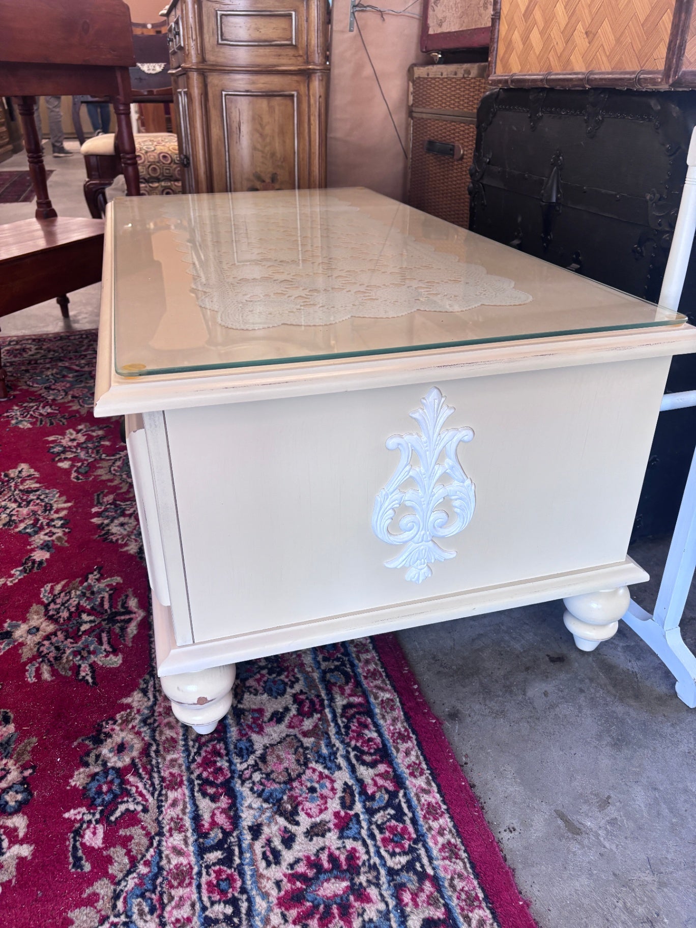 White wood coffee table with glass top