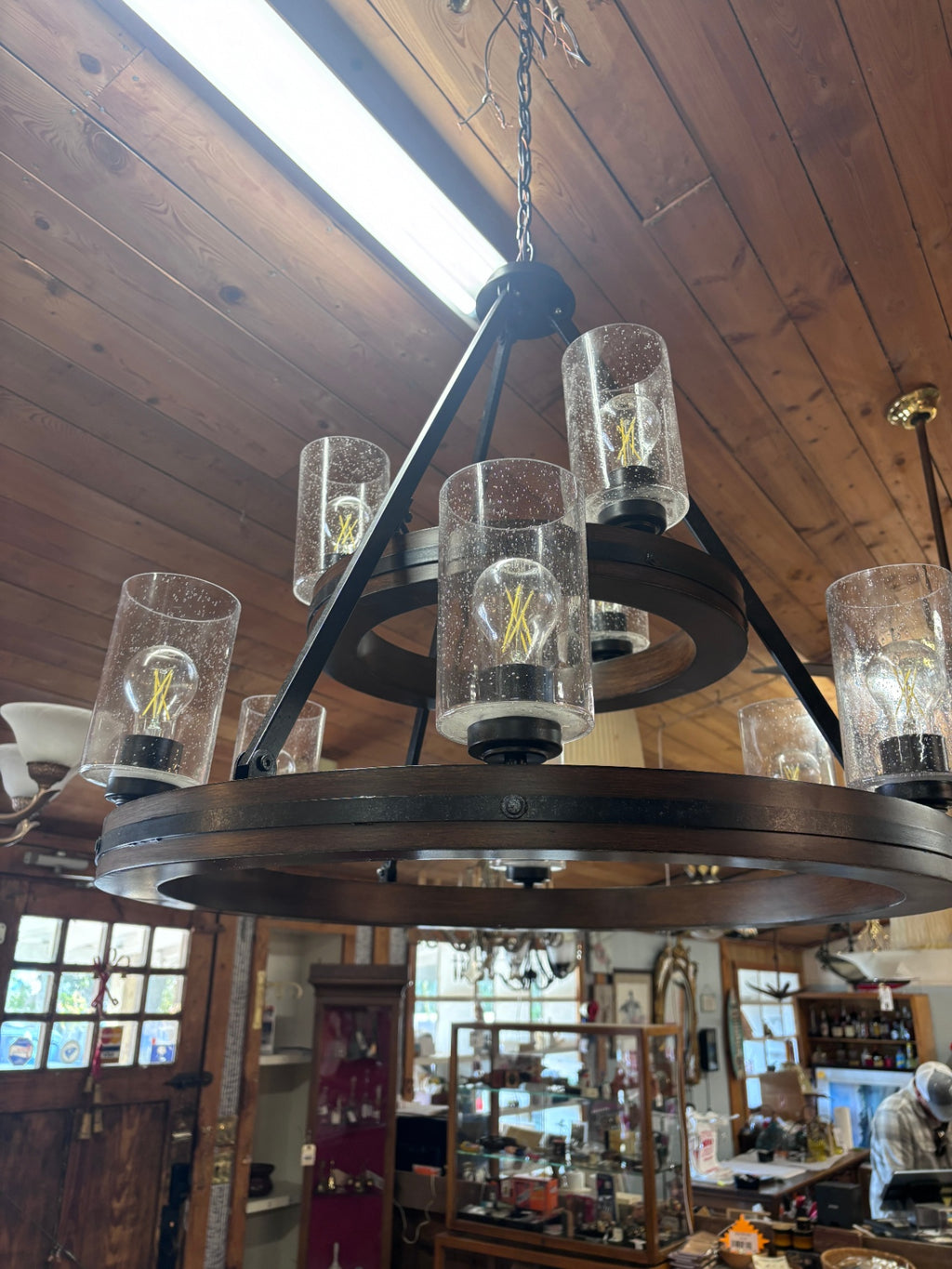 9 Light 2-tier Chandelier features a Distressed Black and Aged Faux Wood finish that adds a vintage charm to any dining room or living room