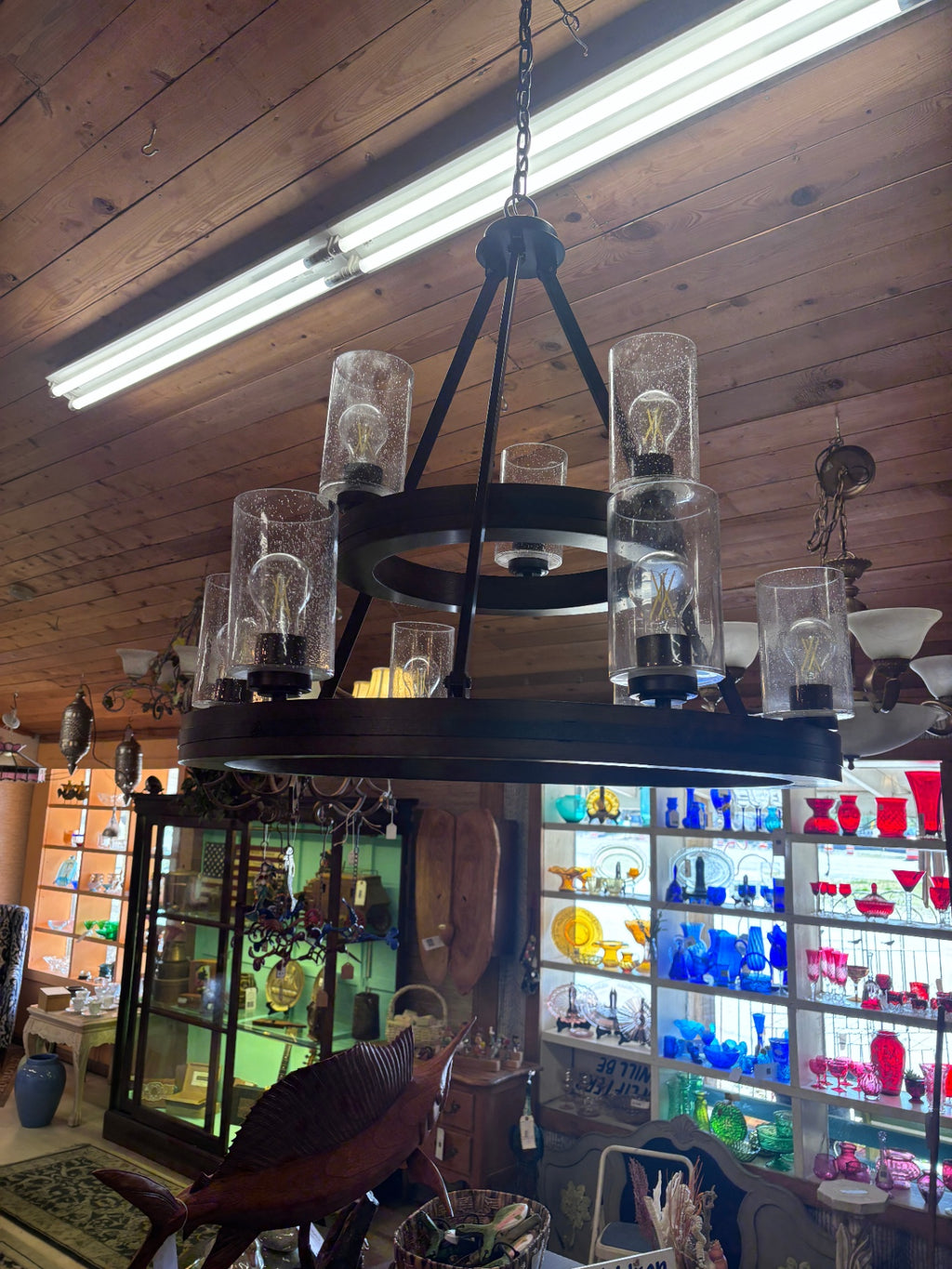 9 Light 2-tier Chandelier features a Distressed Black and Aged Faux Wood finish that adds a vintage charm to any dining room or living room