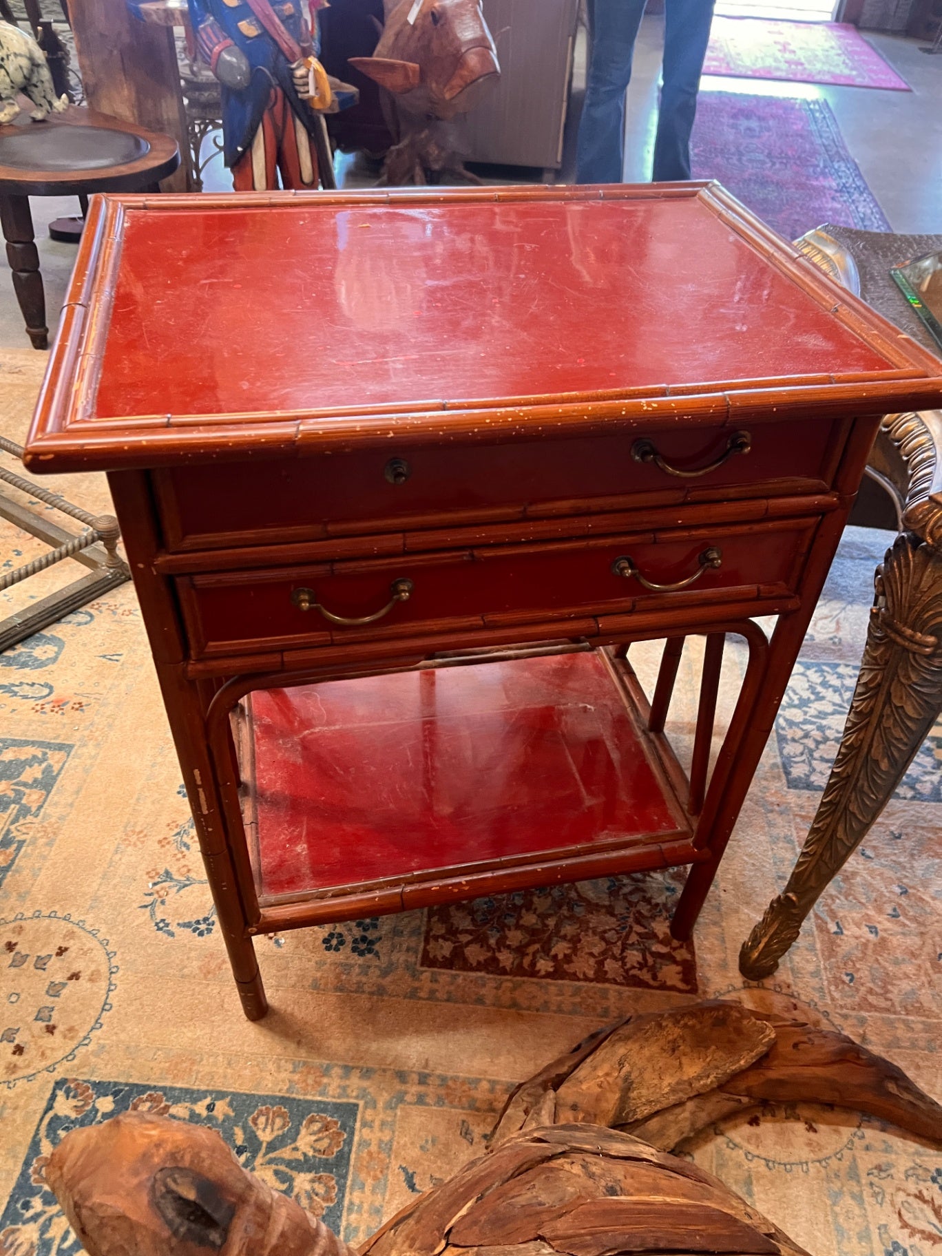 Antique bamboo side table with a red lacquer finish