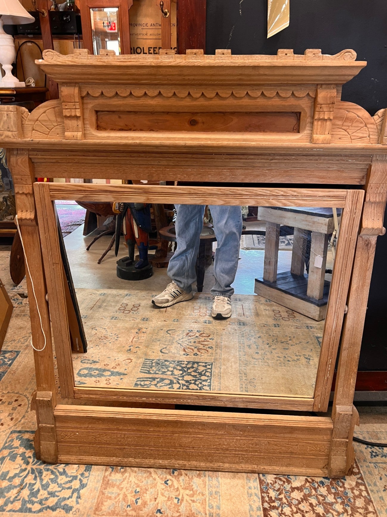 This item is a vintage Eastlake style mirror featuring a tilting mechanism
