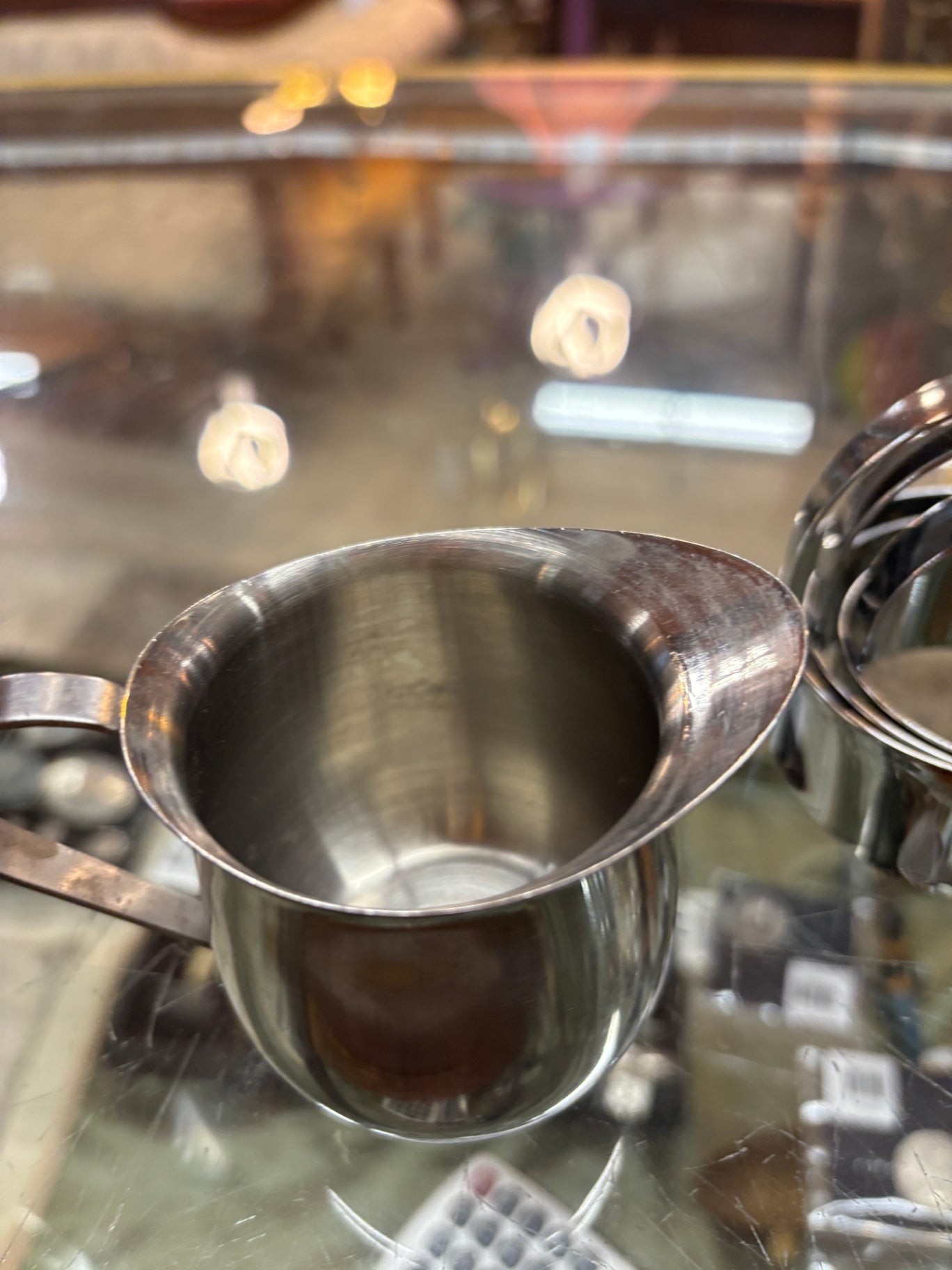 Small stainless steel creamer or individual sauce pitcher