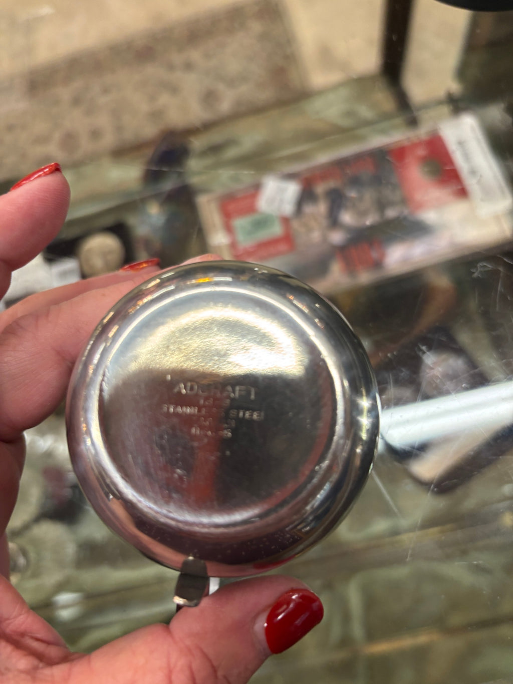 Small stainless steel creamer or individual sauce pitcher