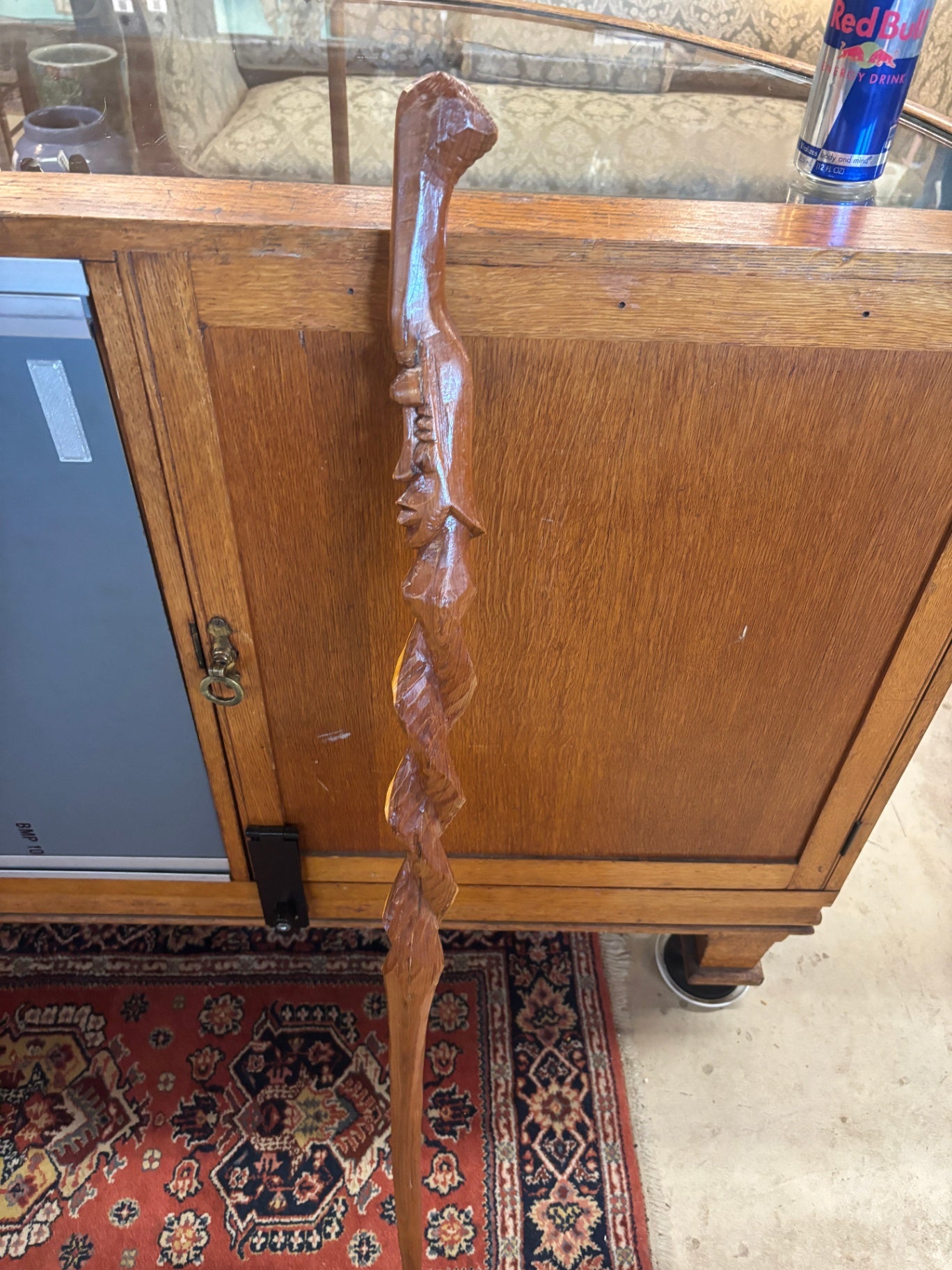 -Carved Wooden Walking Stick Featuring a Tribal Face