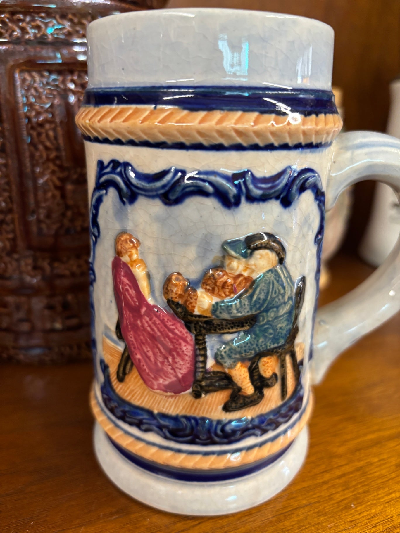 Vintage German Relief Stoneware Beer Stein – Tavern Drinking Scene – Blue & Cream Salt-Glazed Mug