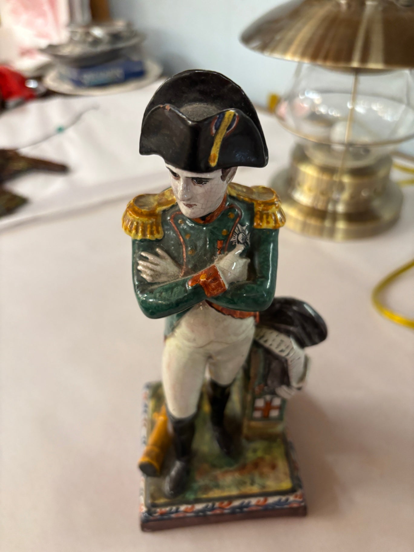 Hand-painted ceramic figurine depicting Napoleon Bonaparte