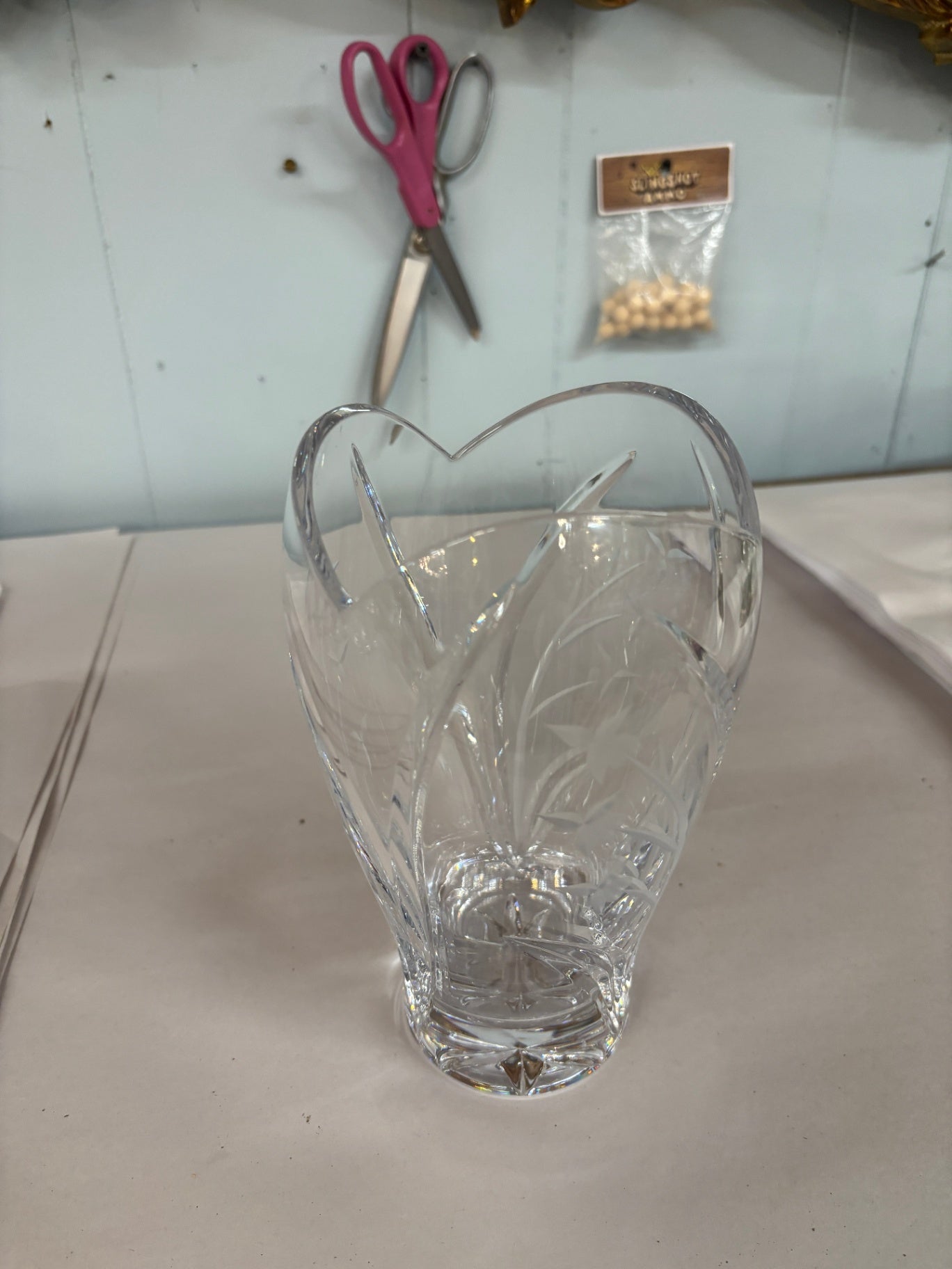 A labeled Lenox 8.25" crystal vase in the Longwood pattern of deep cut flowers with a scalloped rim.