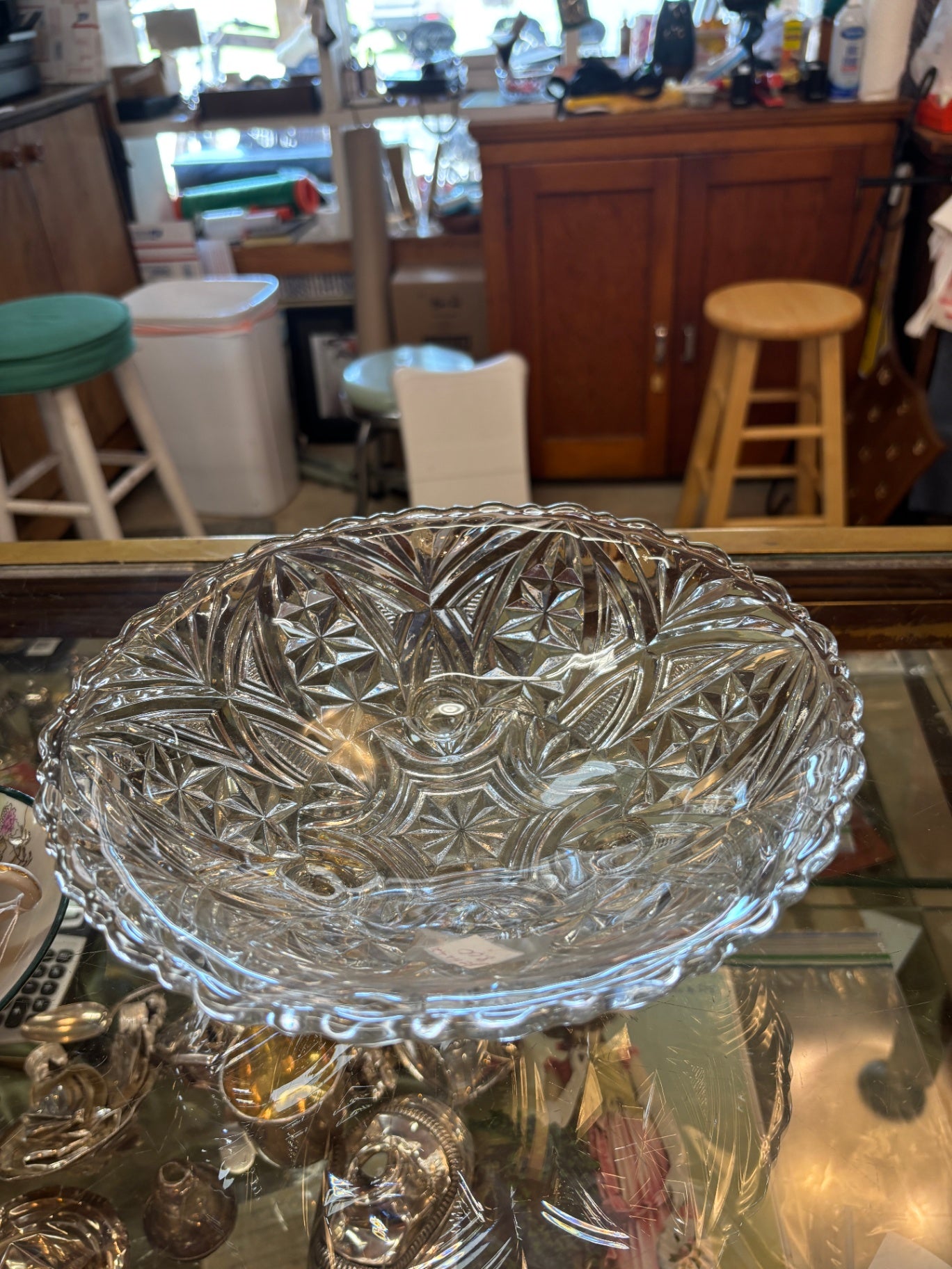 Vintage crystal glass serving bowl featuring a three-toed design