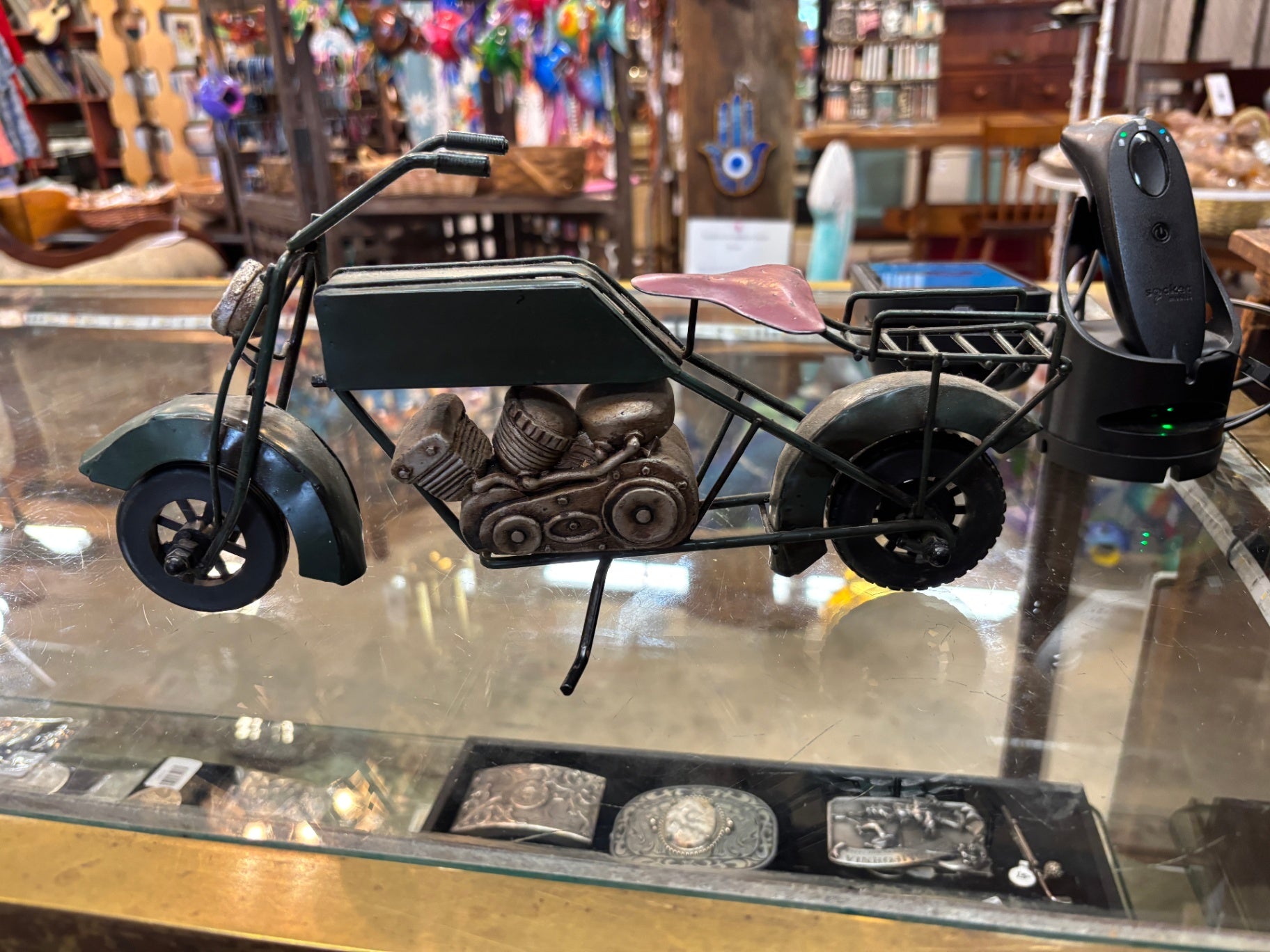 Handcrafted metal motorcycle sculpture made from upcycled scrap materials