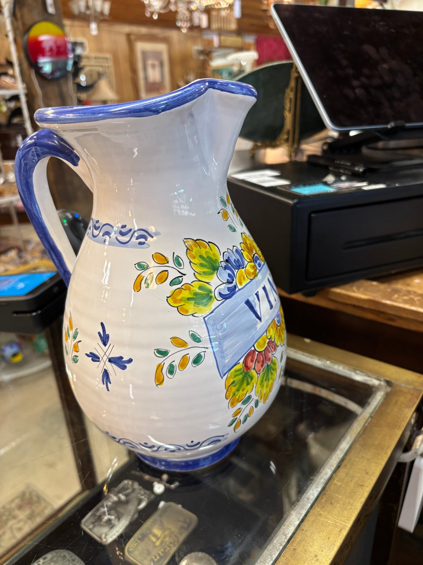 Hand-painted Italian Deruta ceramic "Vino" pitcher featuring vibrant yellow and blue floral and fruit motifs