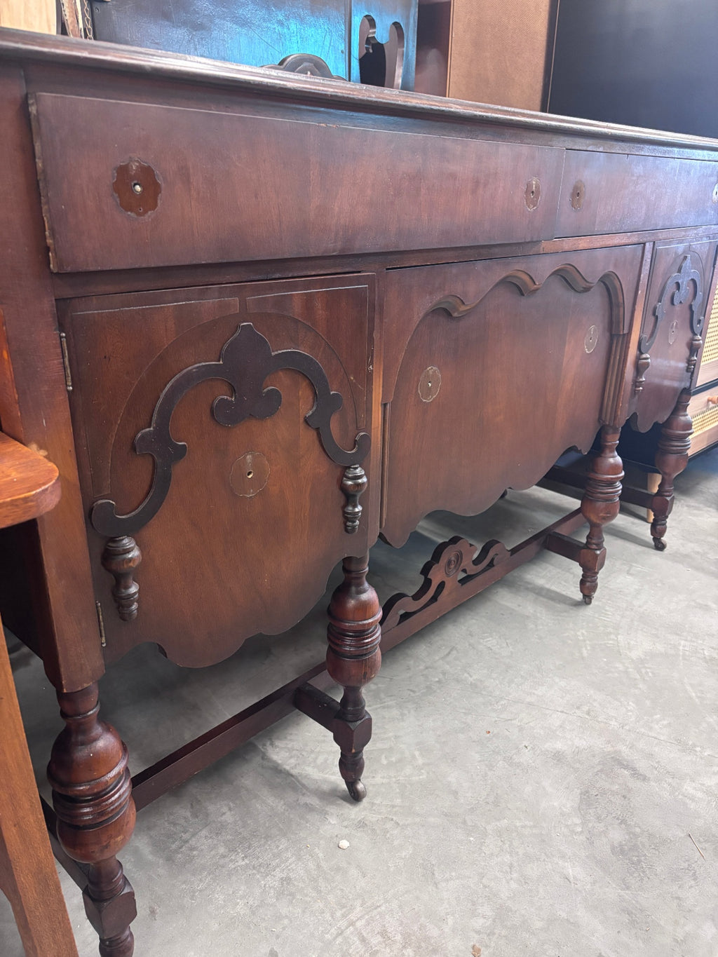 Antique Jacobean Revival style mahogany buffet/sideboard produced by the Reaser Furniture Company