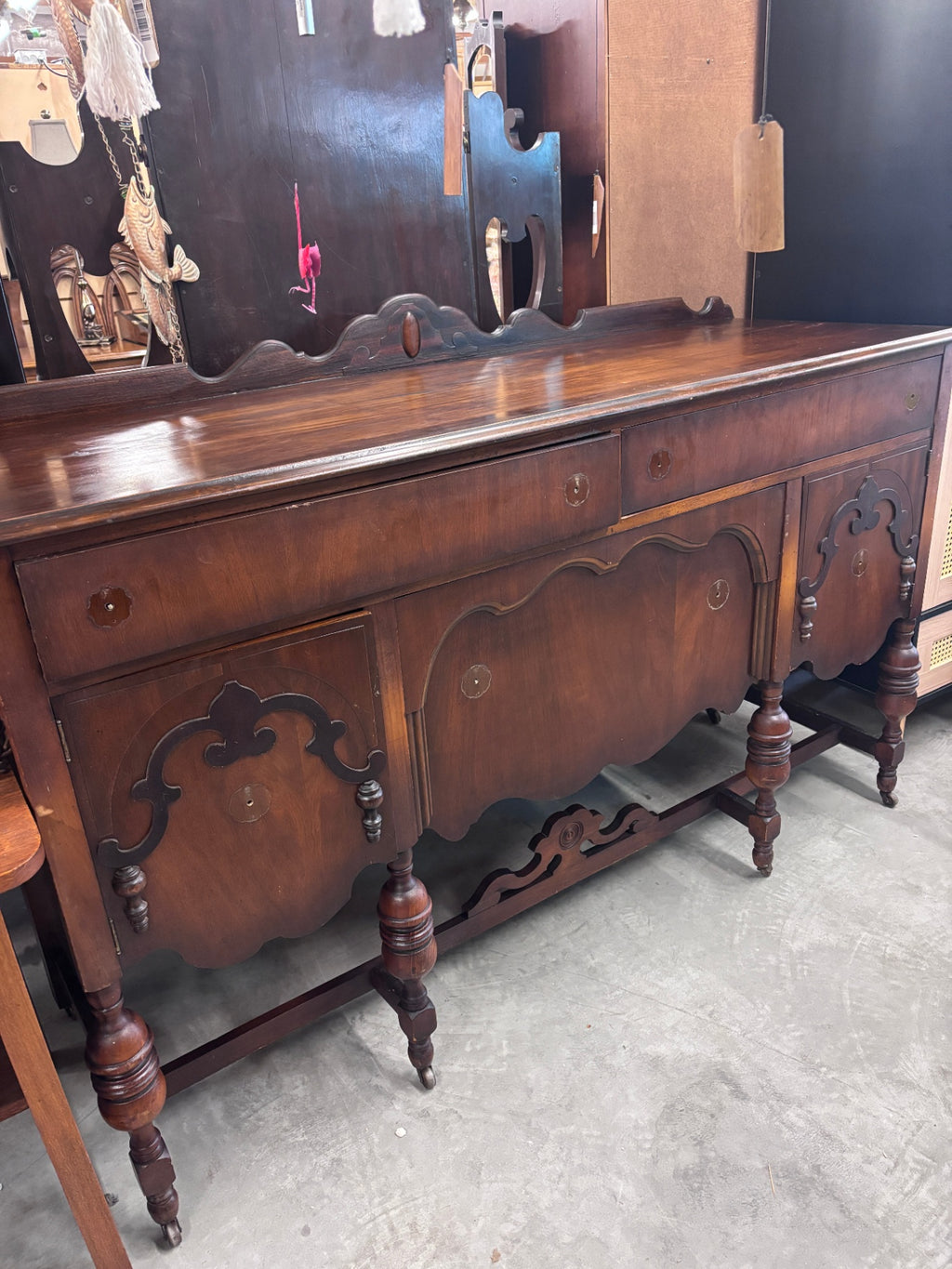Antique Jacobean Revival style mahogany buffet/sideboard produced by the Reaser Furniture Company