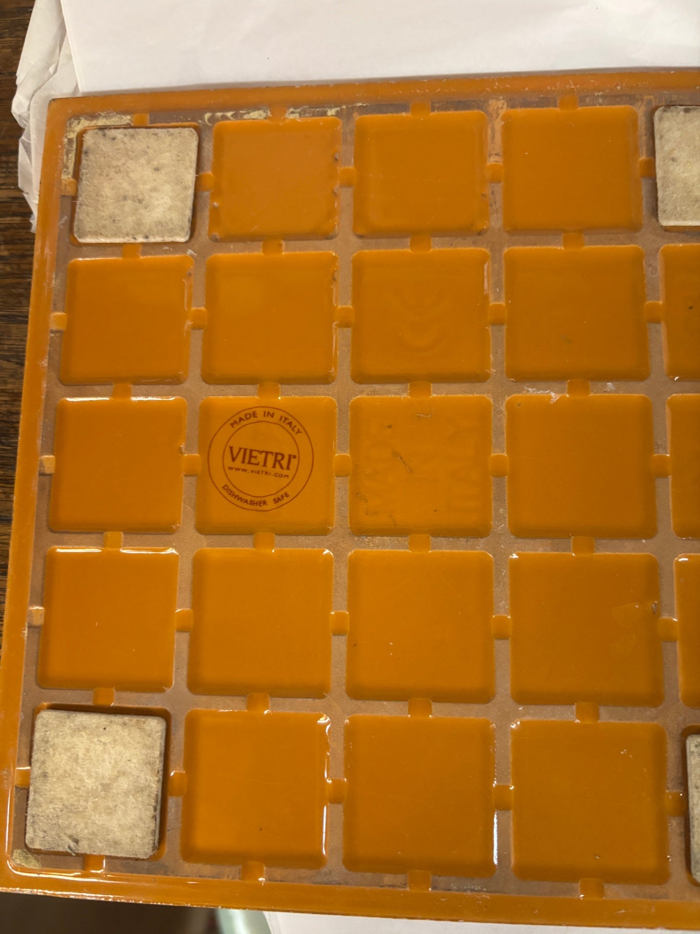 Orange ceramic tile trivet or hot plate made by Vietri in Italy