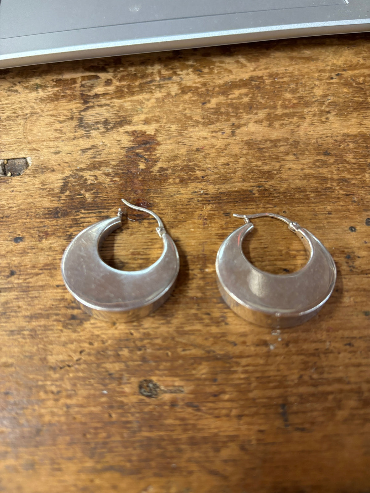 Wide, Crescent-Shaped Silver Hoop Earrings