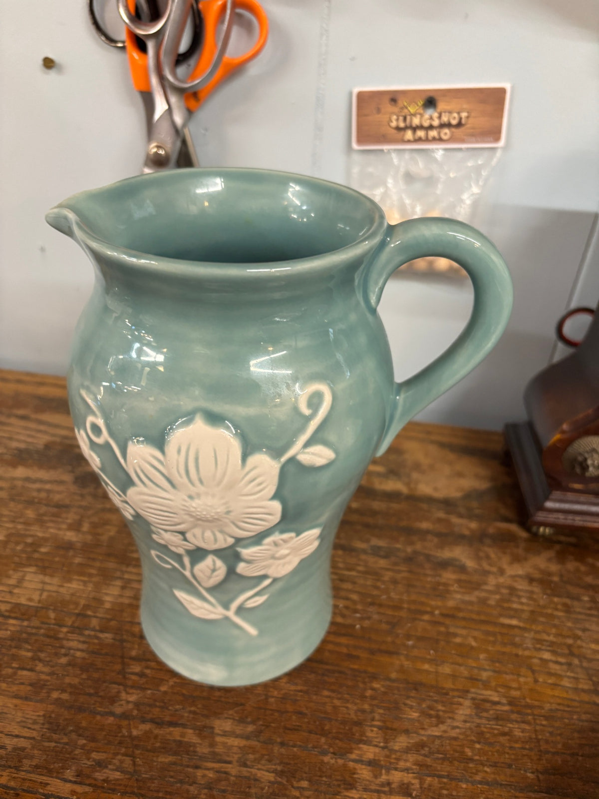 Vintage Celadon Green Ceramic Pitcher with Raised White Floral Design