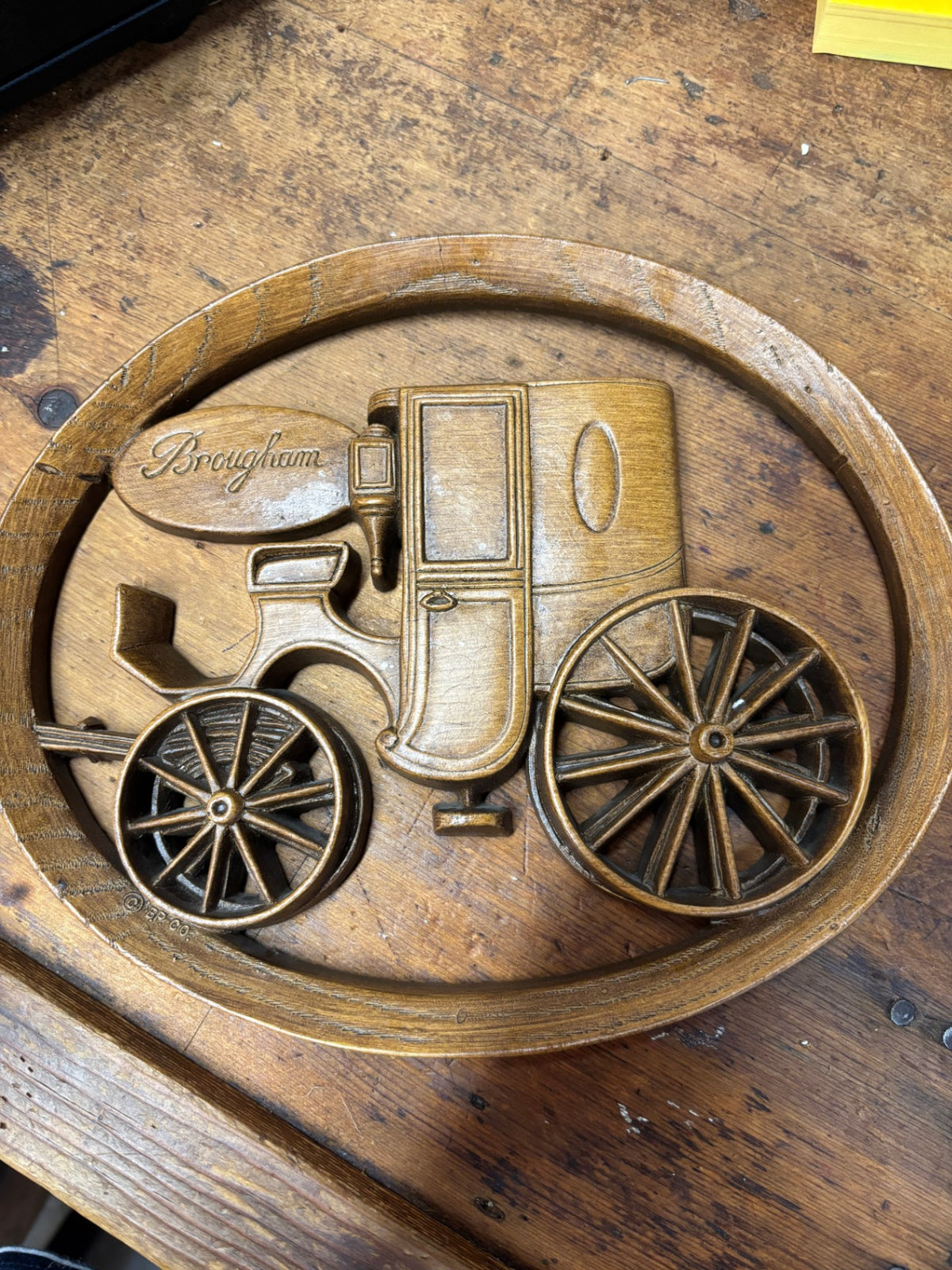 Burwood Products Company molded plastic wall plaque featuring a horse-drawn Brougham carriage