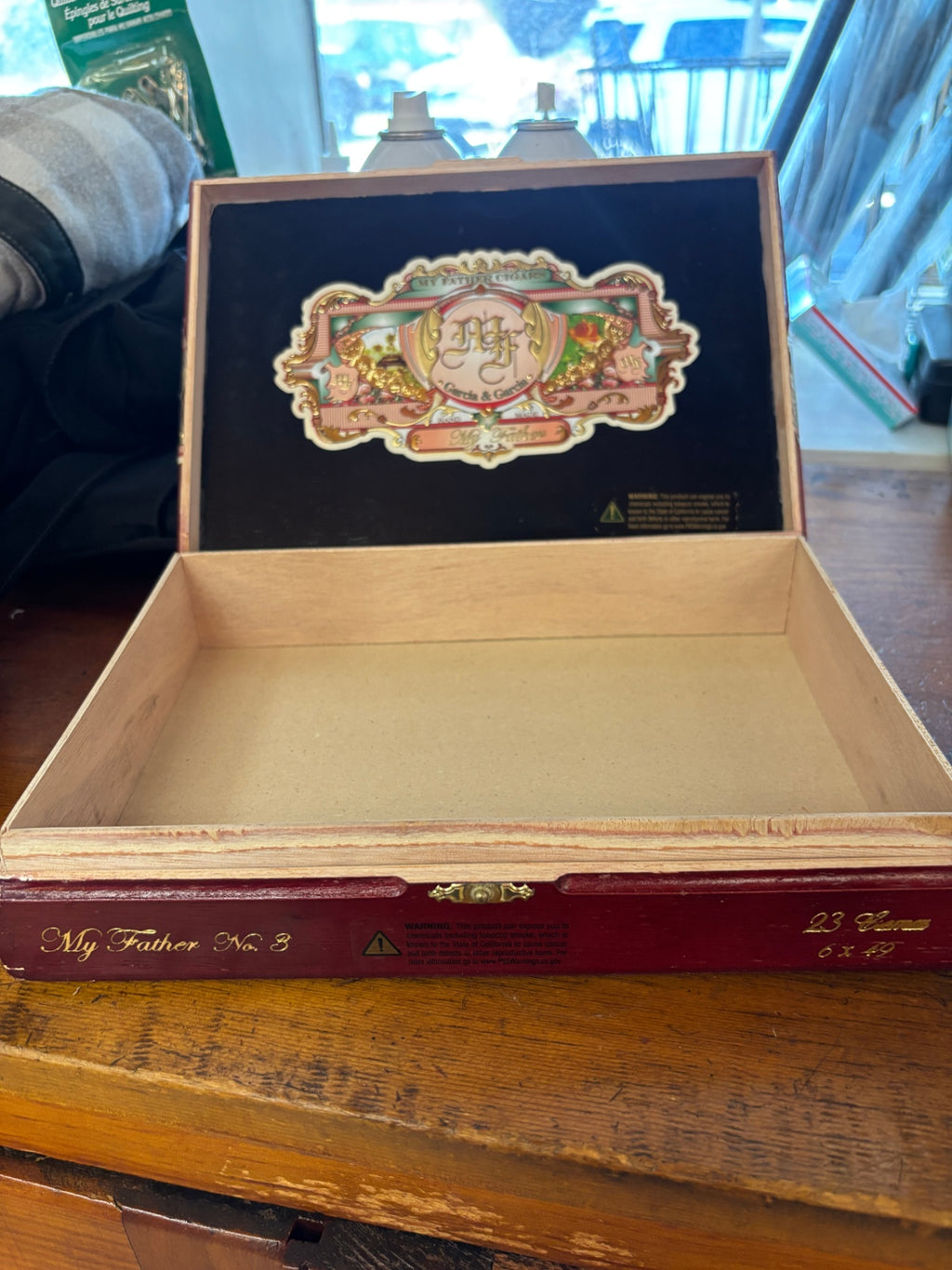 Wooden cigar box from My Father Cigars, featuring their signature ornate red, green, and gold label with the "MF" Garcia & García crest