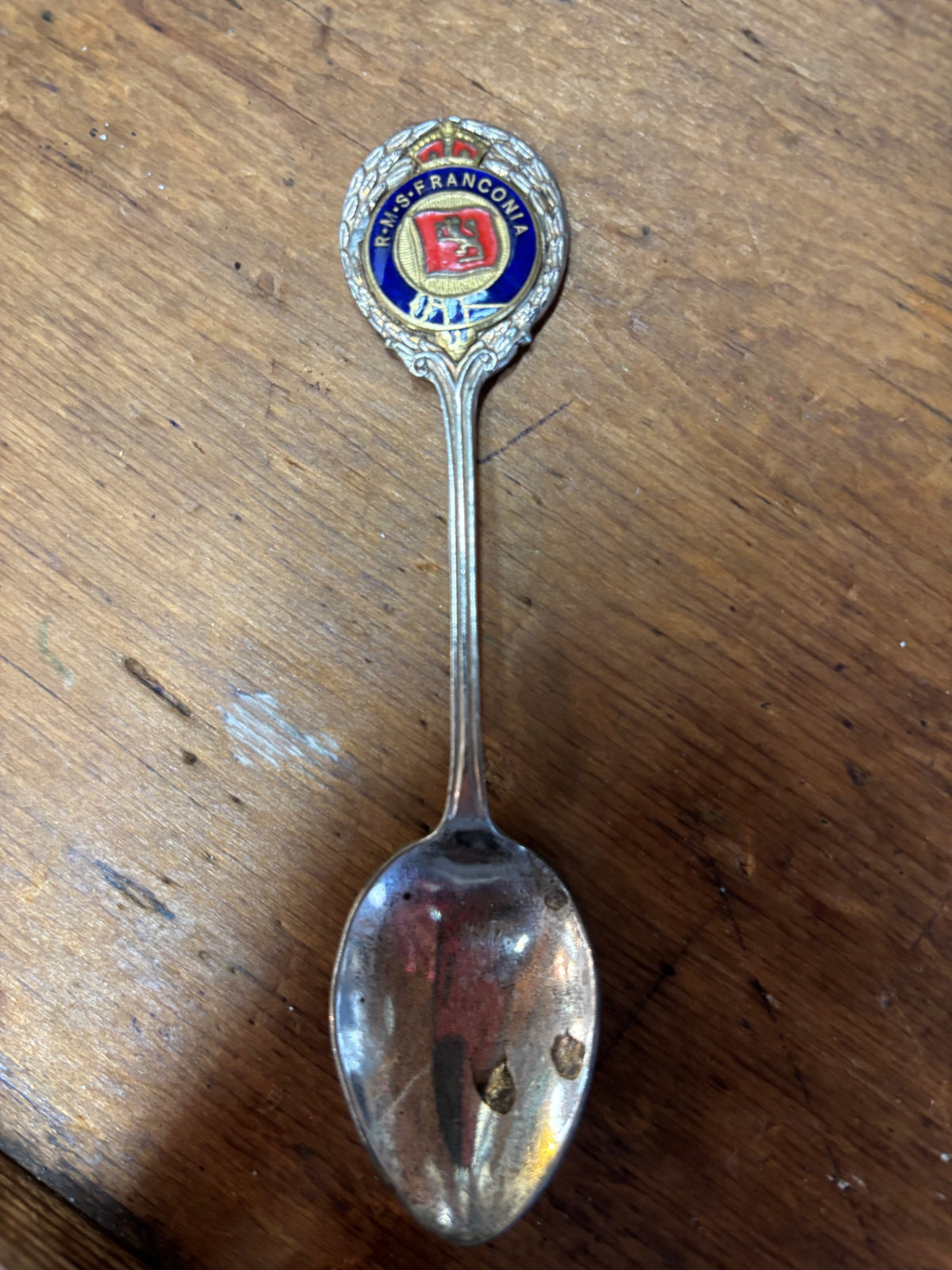 vintage souvenir spoon featuring the crest and name of the ocean liner RMS Franconia from the Cunard Line