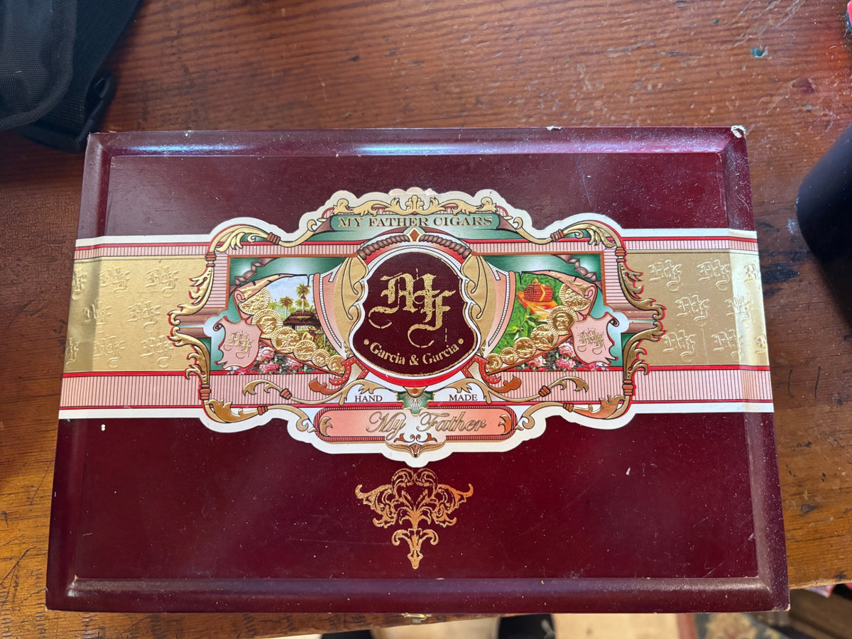 Wooden cigar box from My Father Cigars, featuring their signature ornate red, green, and gold label with the "MF" Garcia & García crest