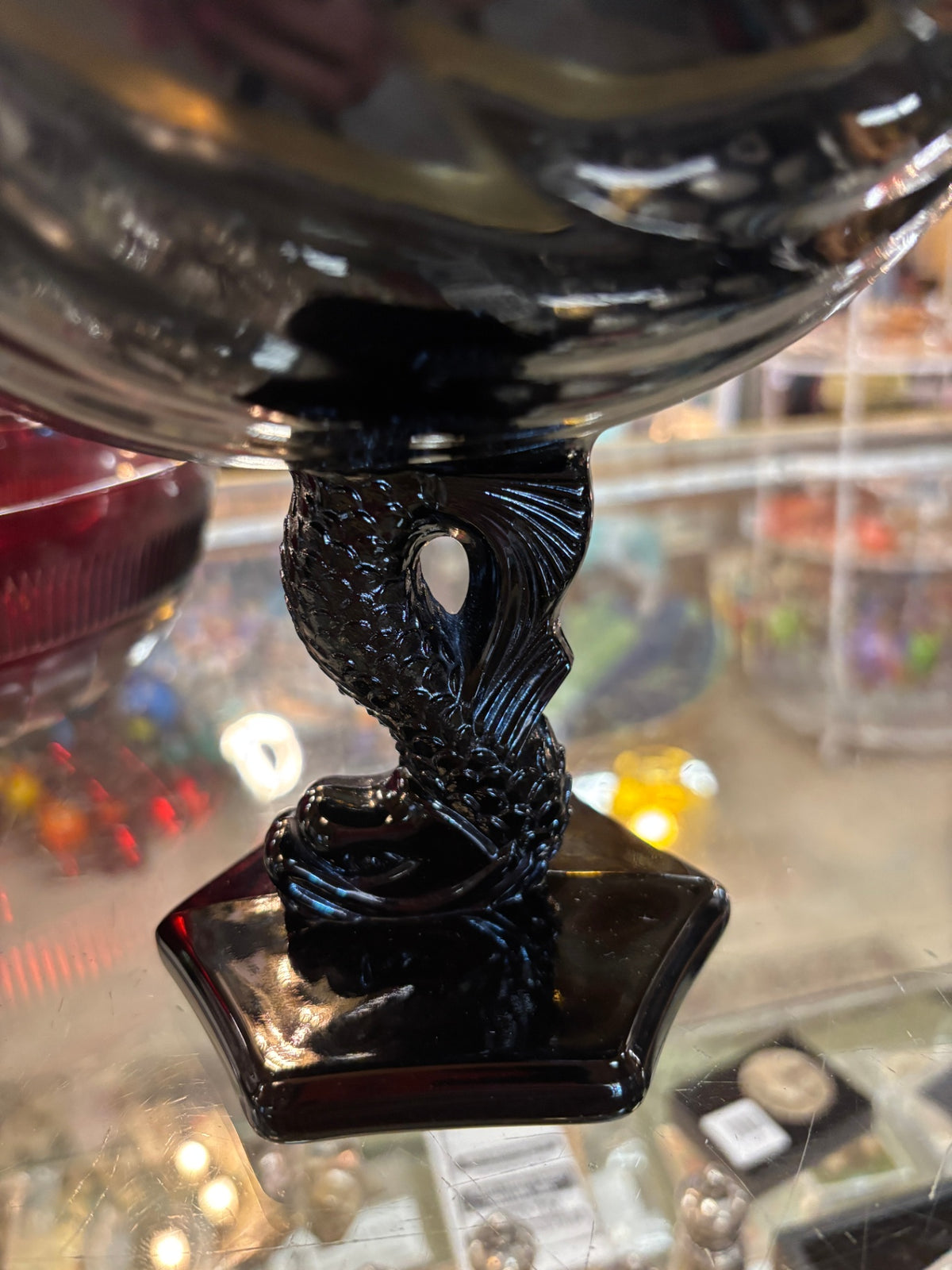 Vintage Westmoreland Glass black glass seashell compote bowl featuring a pedestal base shaped like a dolphin/koi fish