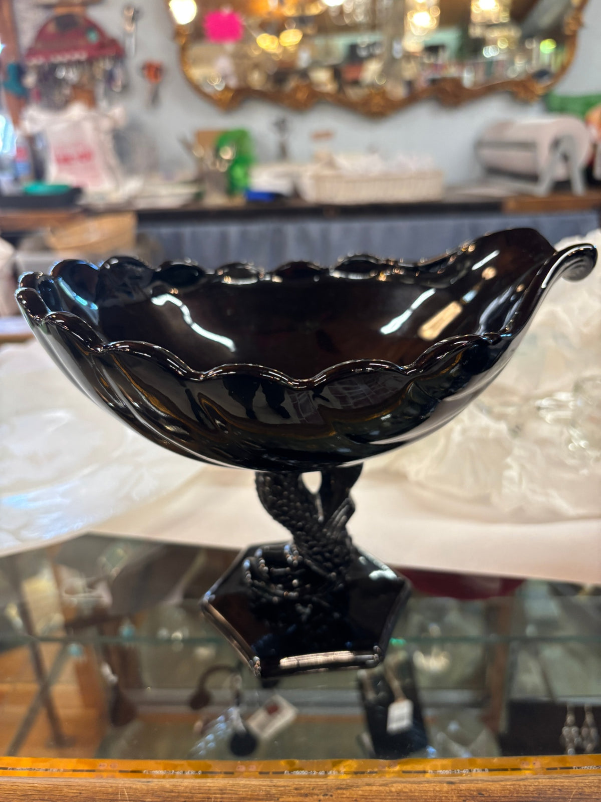 Vintage Westmoreland Glass black glass seashell compote bowl featuring a pedestal base shaped like a dolphin/koi fish