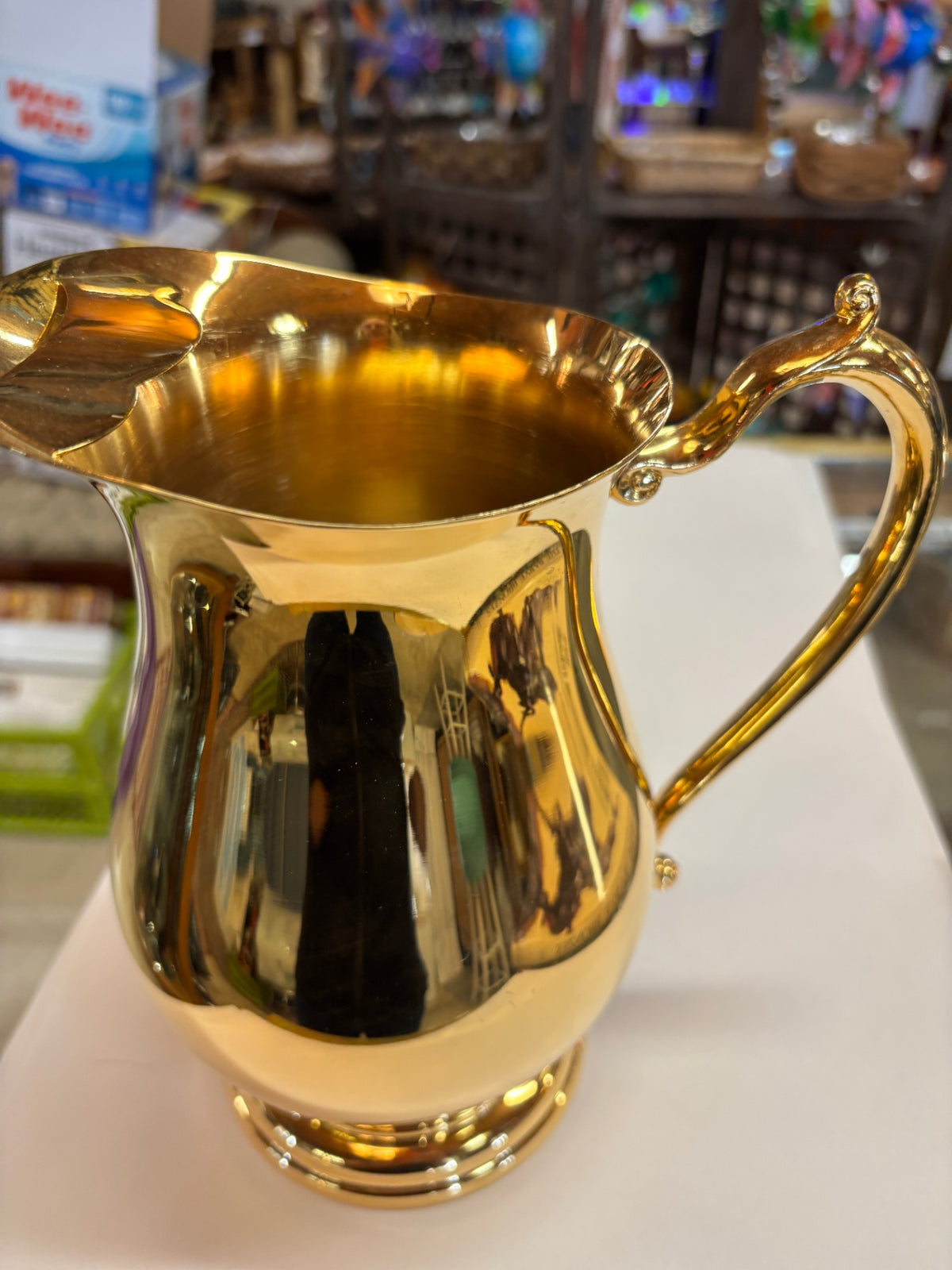 Vintage Polished Brass Pitcher with Ornate Scroll Handle and Decorative Spout