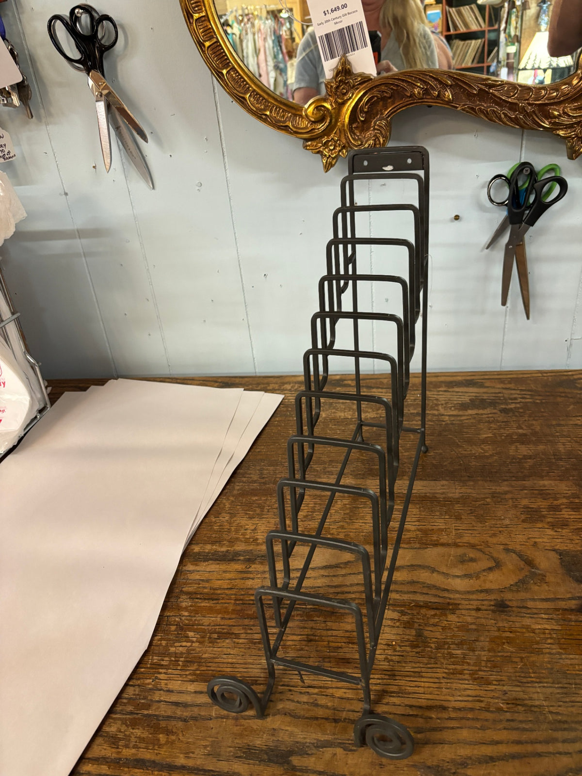 Vintage Wrought Iron 7 Space Book or Picture Holder. Stair Step Display Holder. Curled Metal Legs on Bottom.