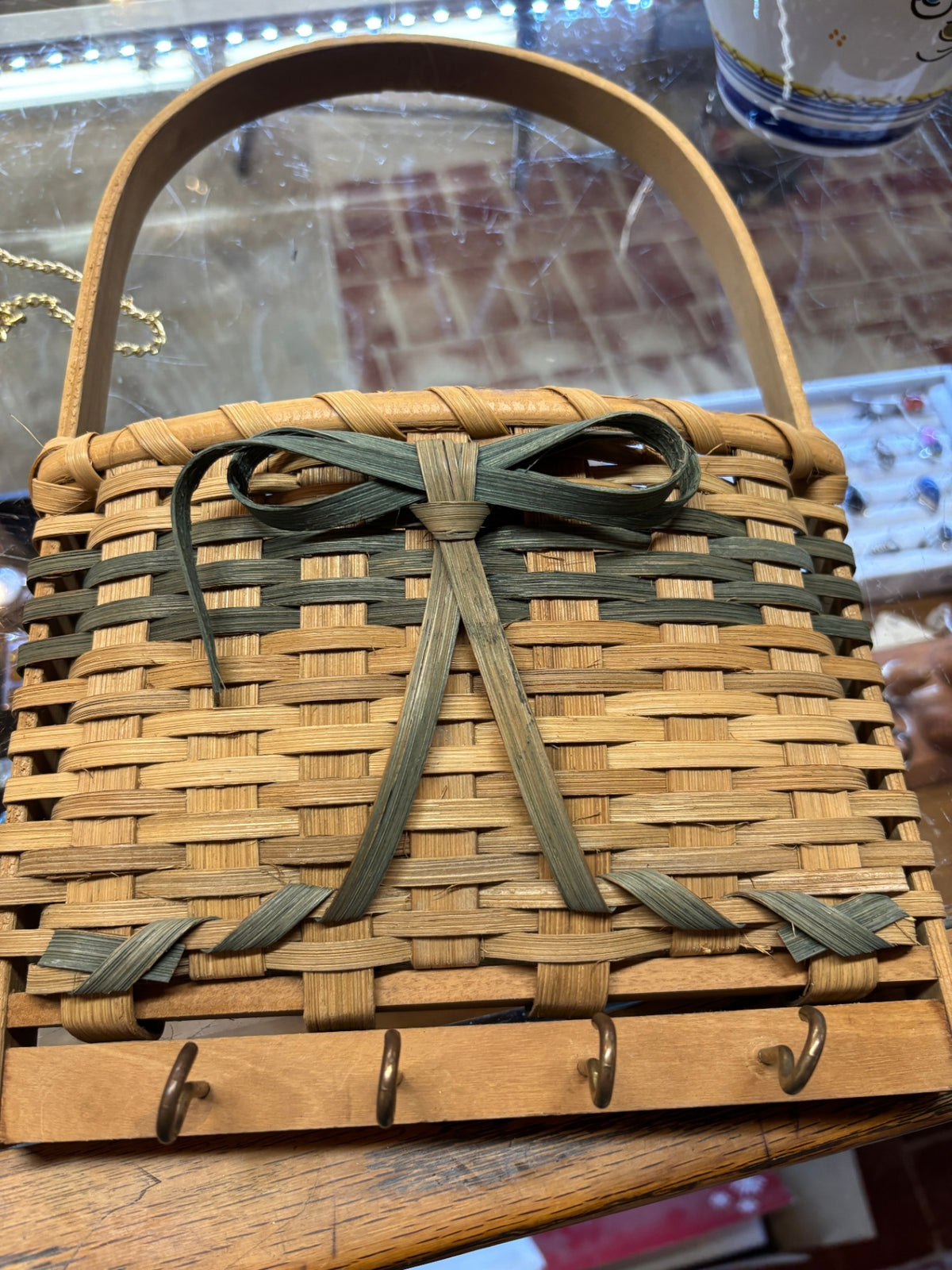 Vintage Handwoven Wicker Wall Basket with Key Hooks and Decorative Green Bow
