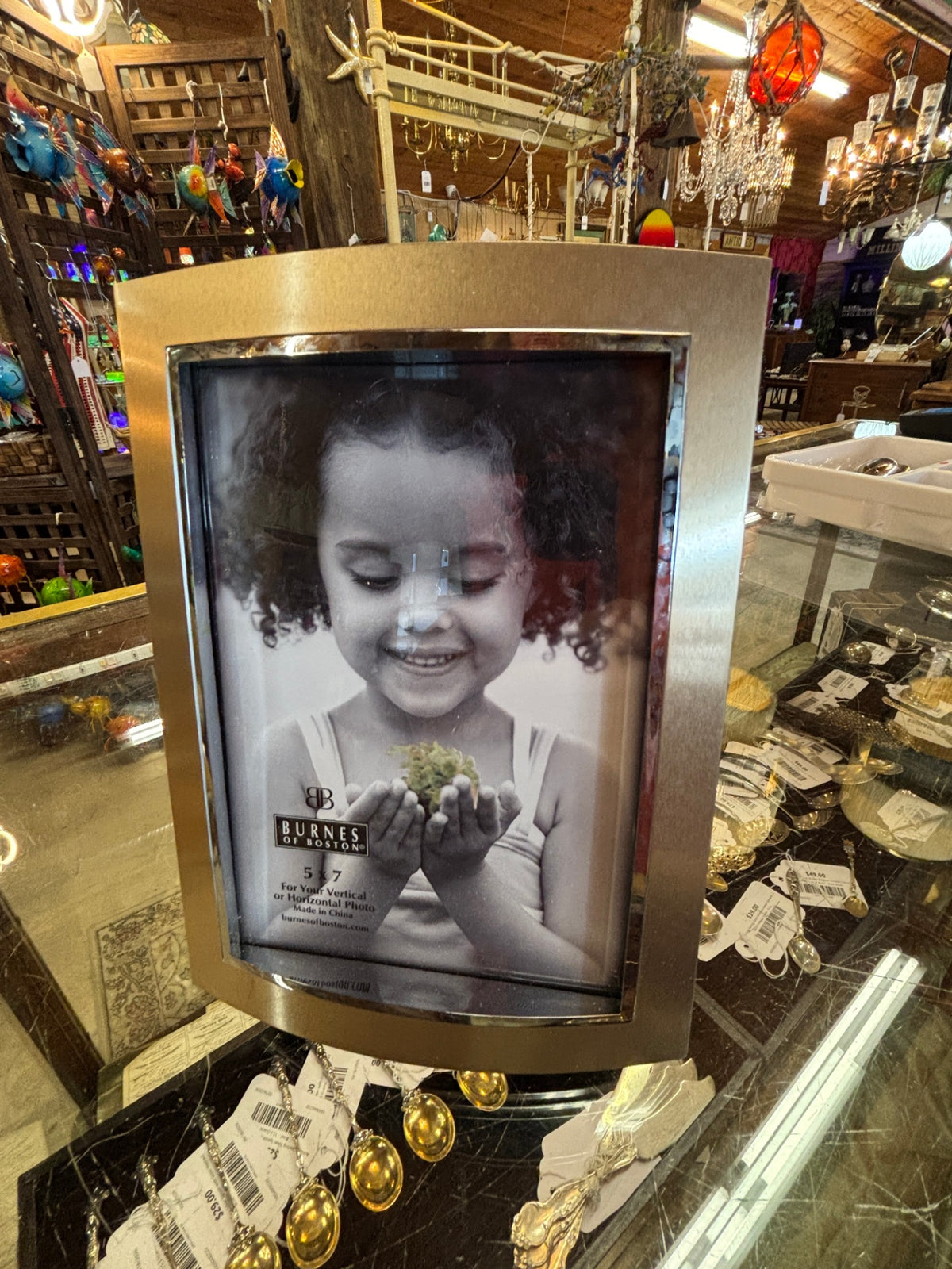 Burnes of Boston curved metal photo frame designed for a 5x7-inch vertical or horizontal picture